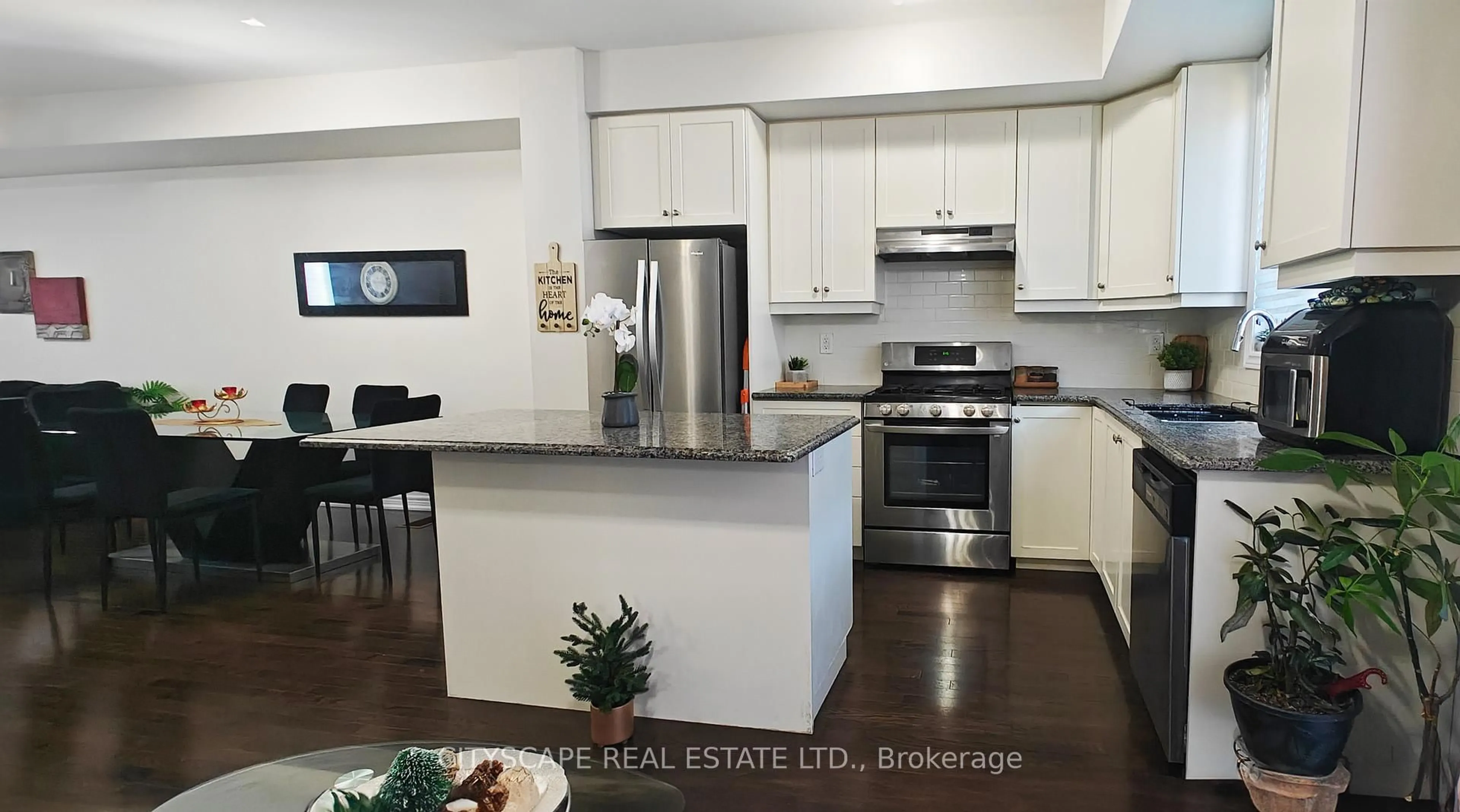 Open concept kitchen, wood/laminate floor for 74 Esplanade Lane, Grimsby Ontario L3M 0H2