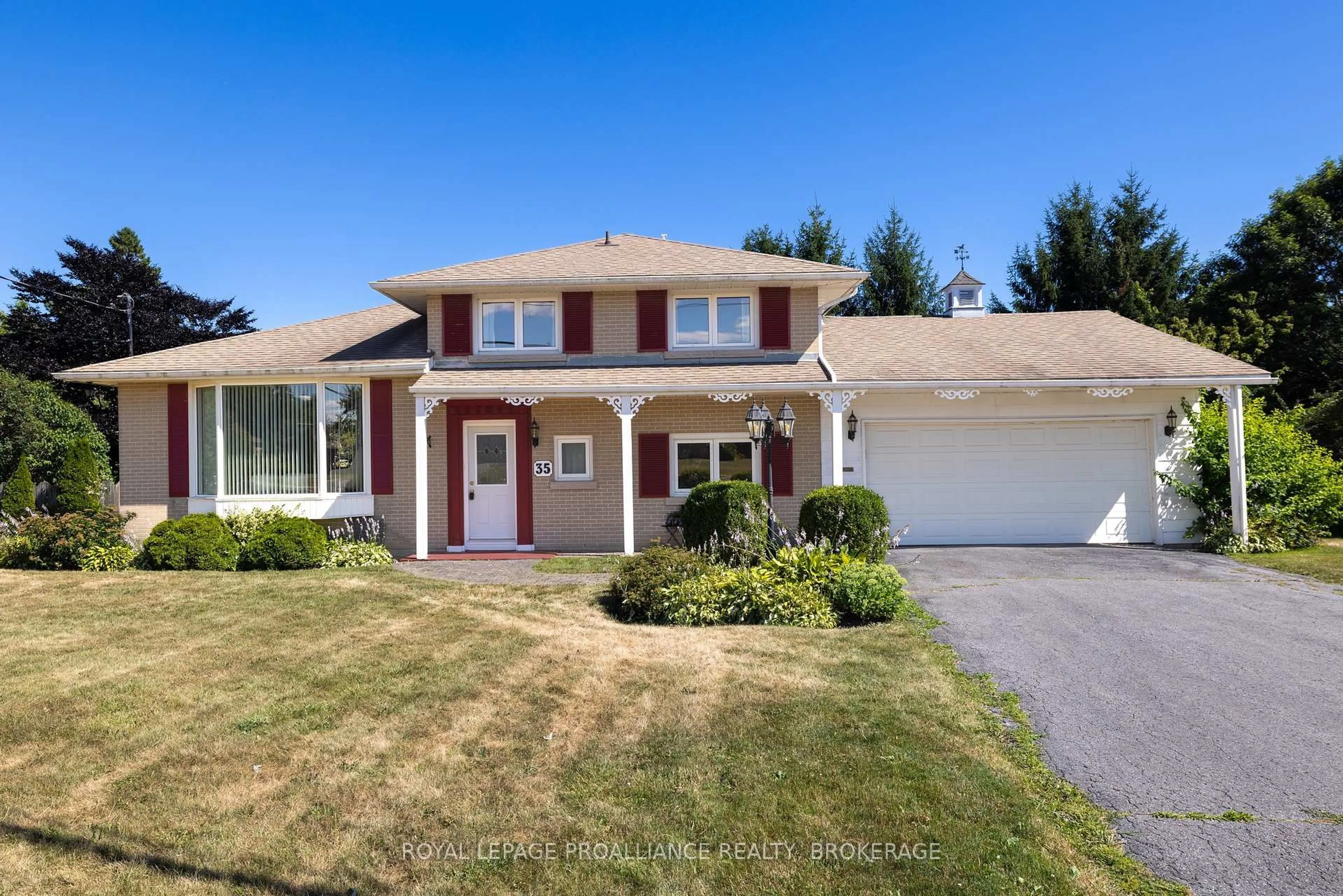 Home with vinyl exterior material, street for 35 Manitou Cres, Loyalist Ontario K7N 1B1