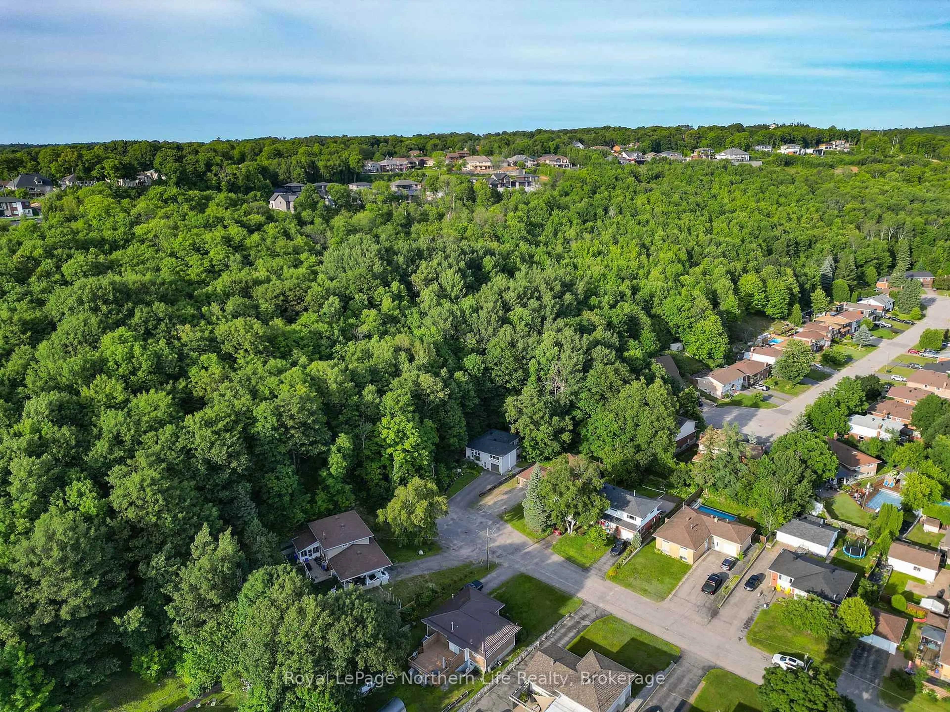A pic from outside/outdoor area/front of a property/back of a property/a pic from drone, forest/trees view for 190 Balsam Cres, North Bay Ontario P1B 6M3