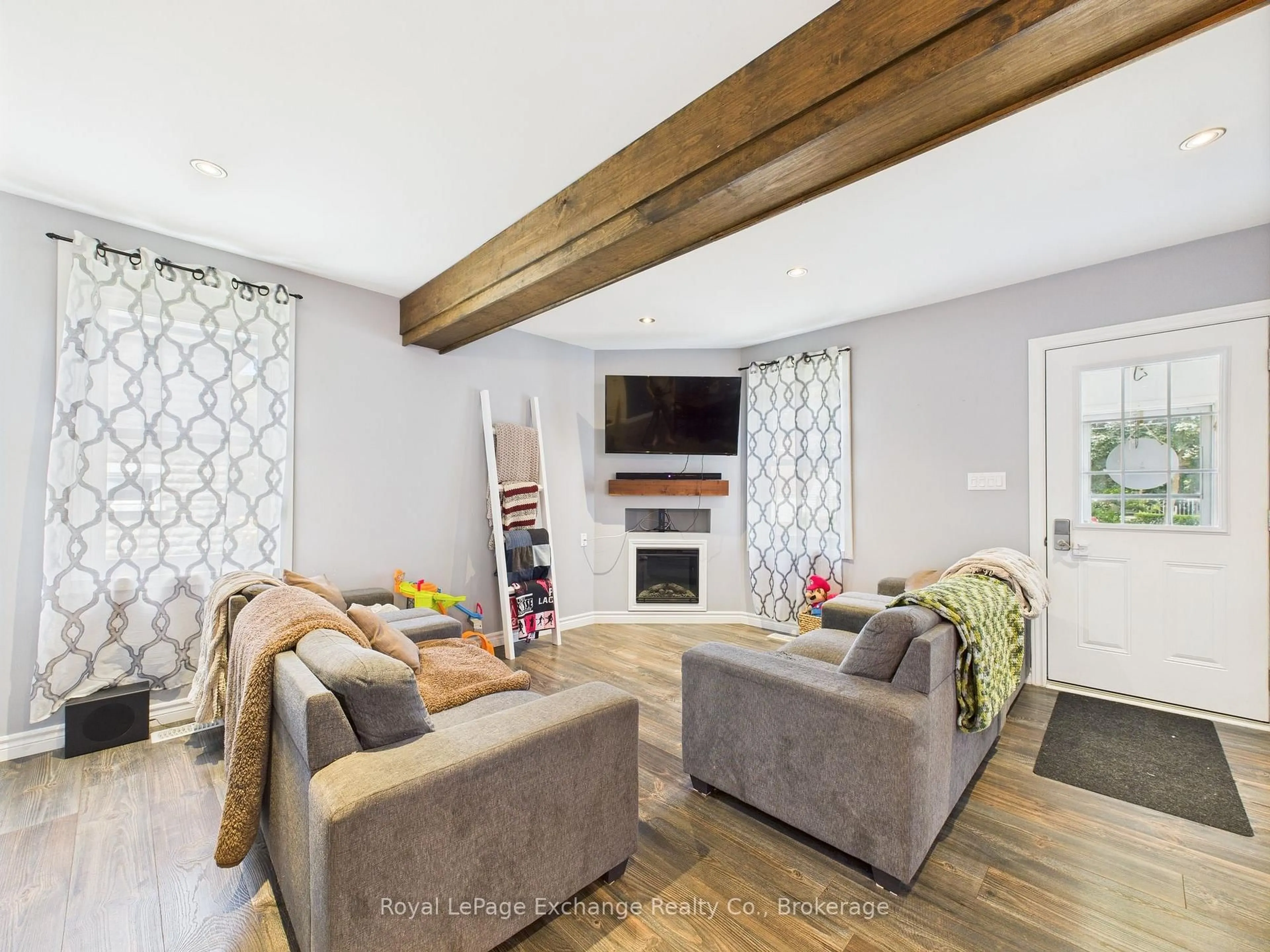 Living room with furniture, wood/laminate floor for 164 Victoria St, North Huron Ontario N0G 2W0