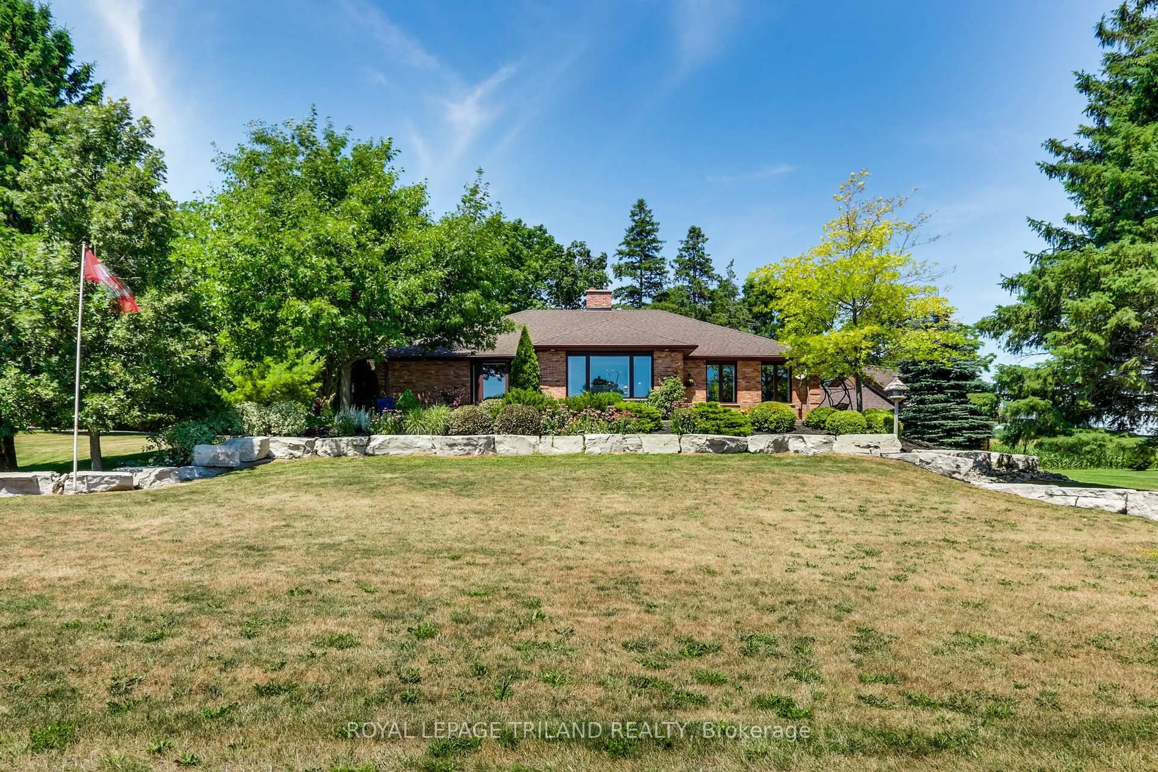 A pic from outside/outdoor area/front of a property/back of a property/a pic from drone, unknown for 22604 Vanneck Rd, Middlesex Centre Ontario N0M 2A0