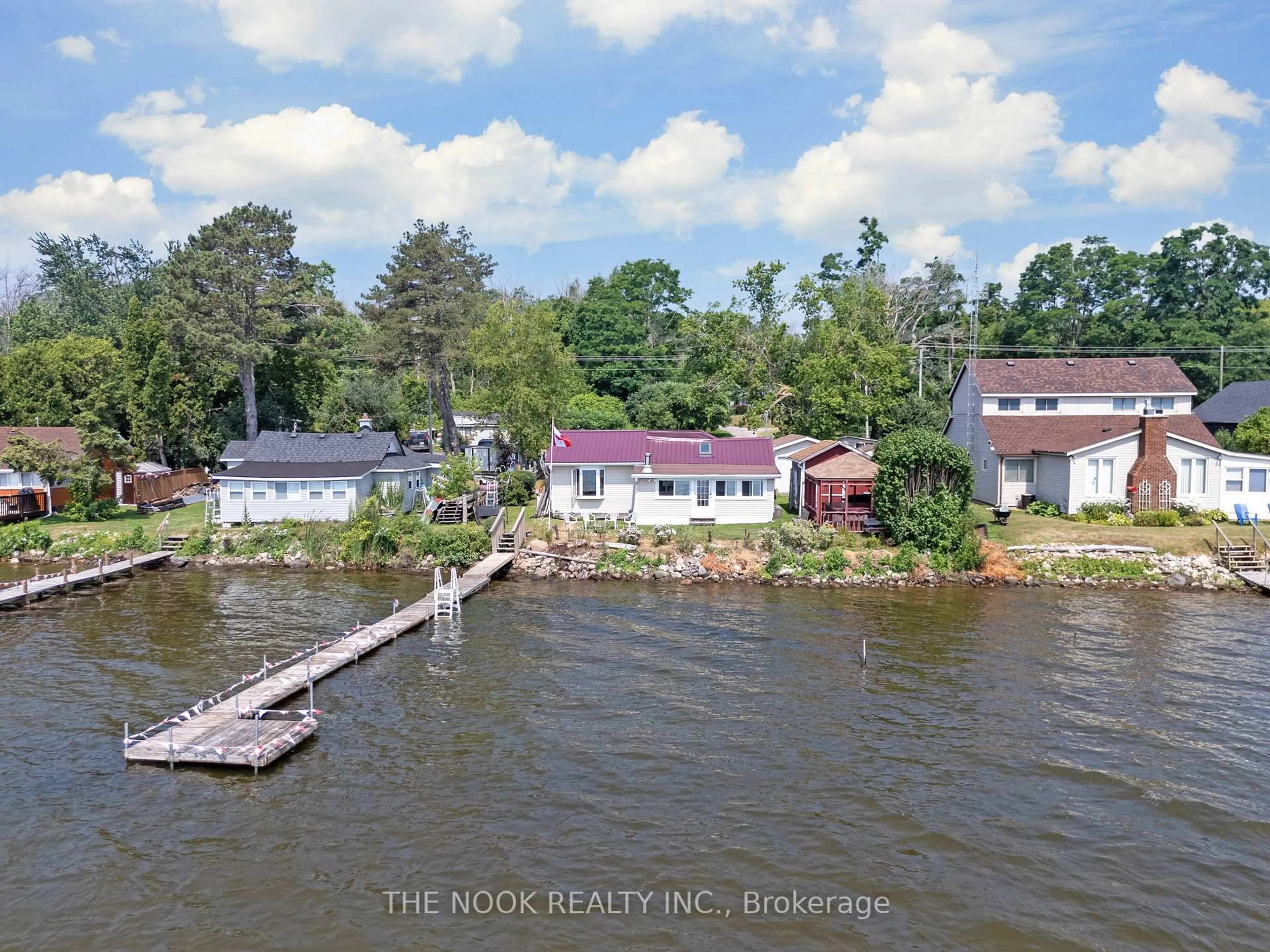 A pic from outside/outdoor area/front of a property/back of a property/a pic from drone, water/lake/river/ocean view for 187 Paudash St, Hiawatha First Nation Ontario K9J 6X8