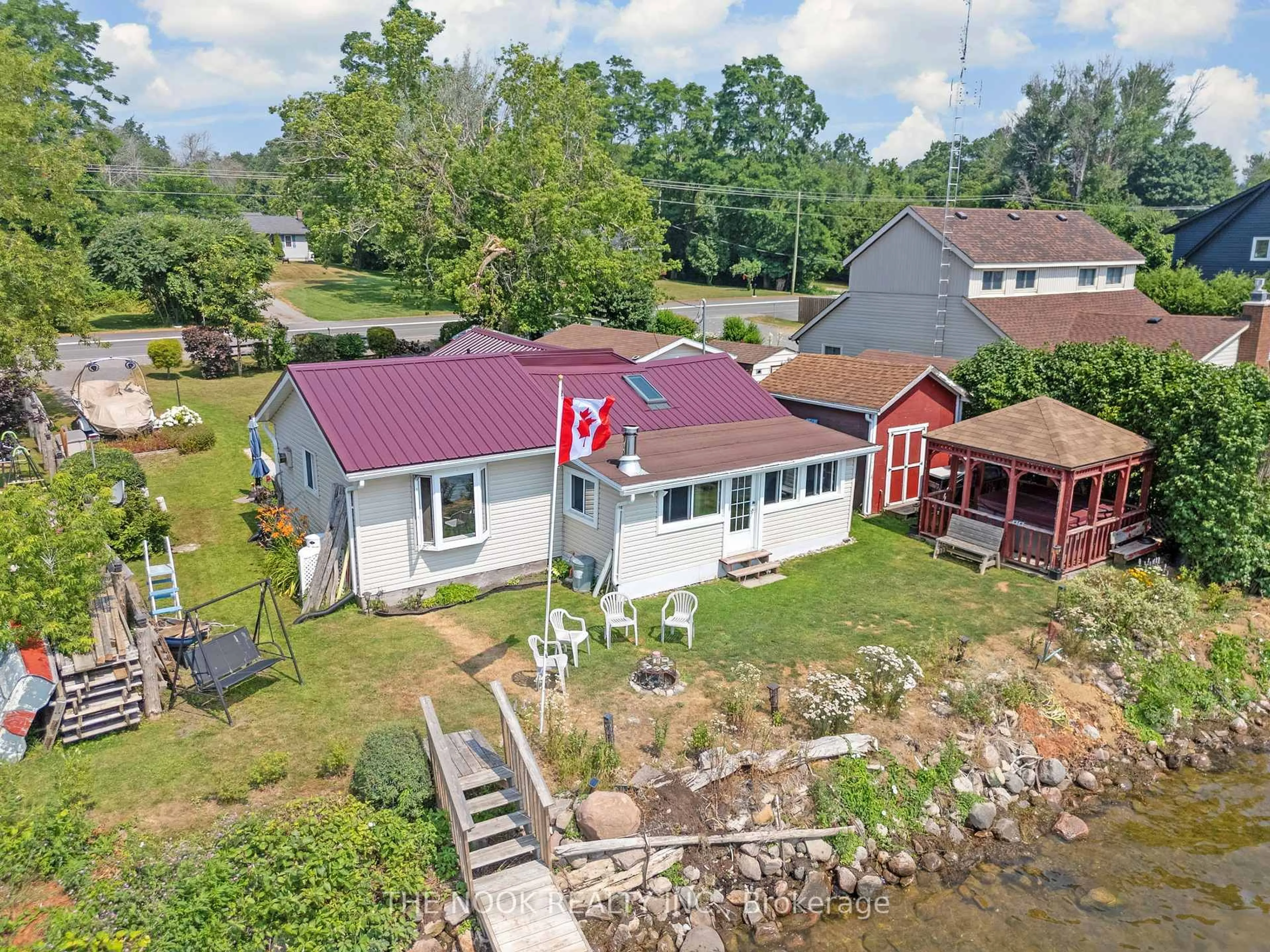 A pic from outside/outdoor area/front of a property/back of a property/a pic from drone, water/lake/river/ocean view for 187 Paudash St, Hiawatha First Nation Ontario K9J 6X8