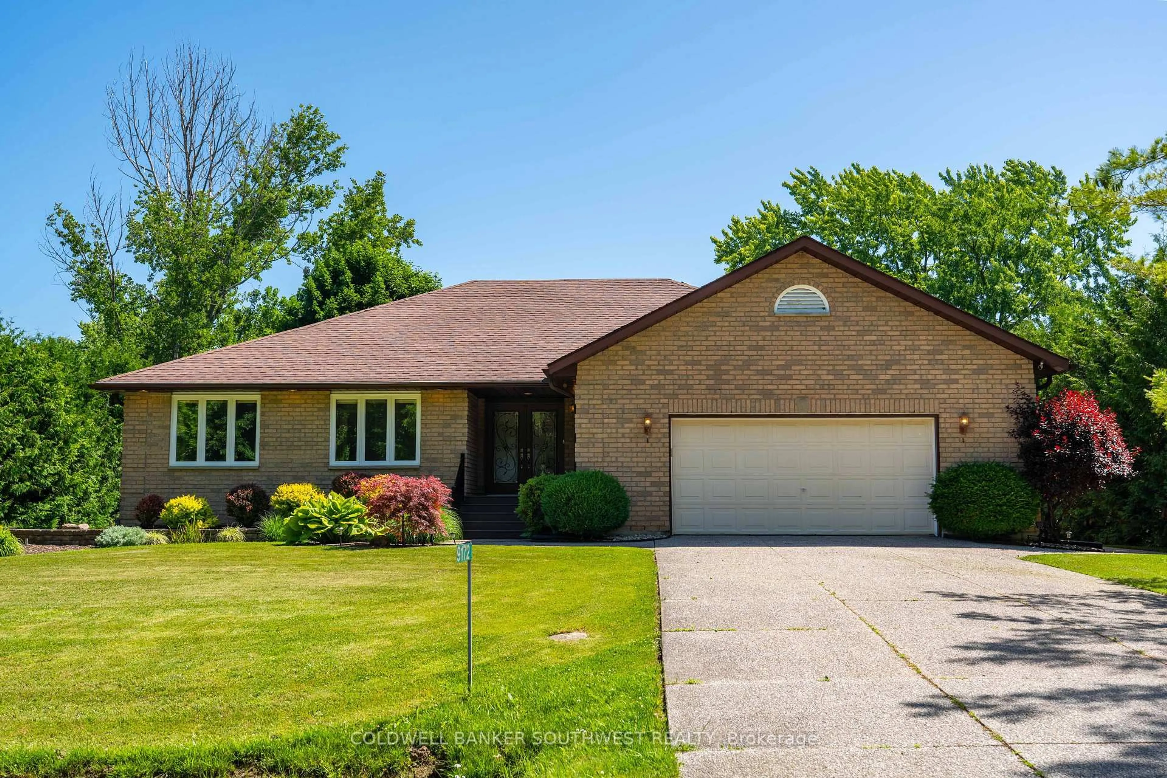Home with brick exterior material, street for 9172 Indian Hills Tr, Lambton Shores Ontario N0N 1J2