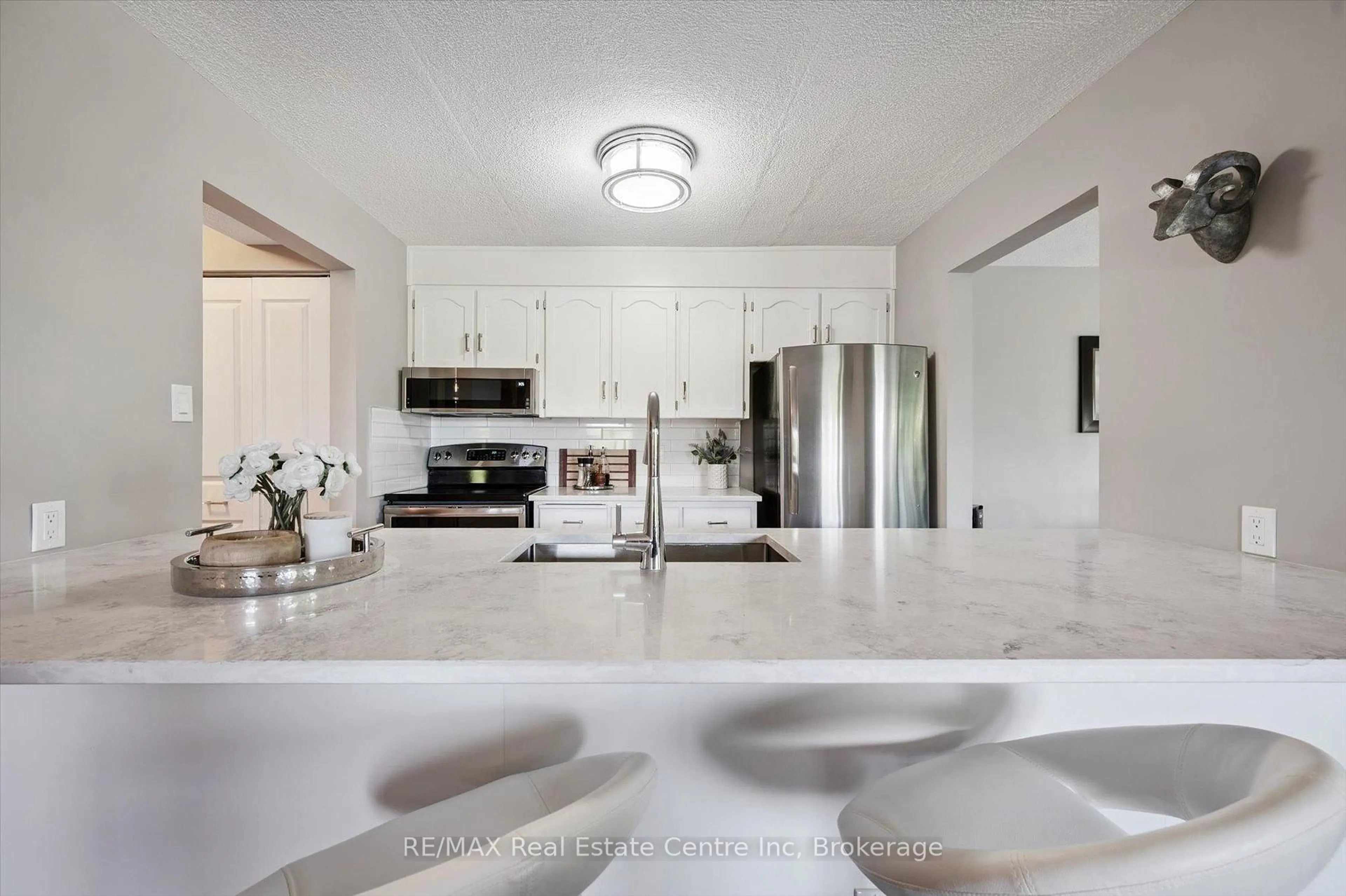Open concept kitchen, ceramic/tile floor for 8 CHRISTOPHER Crt #306, Guelph Ontario N1G 4N7
