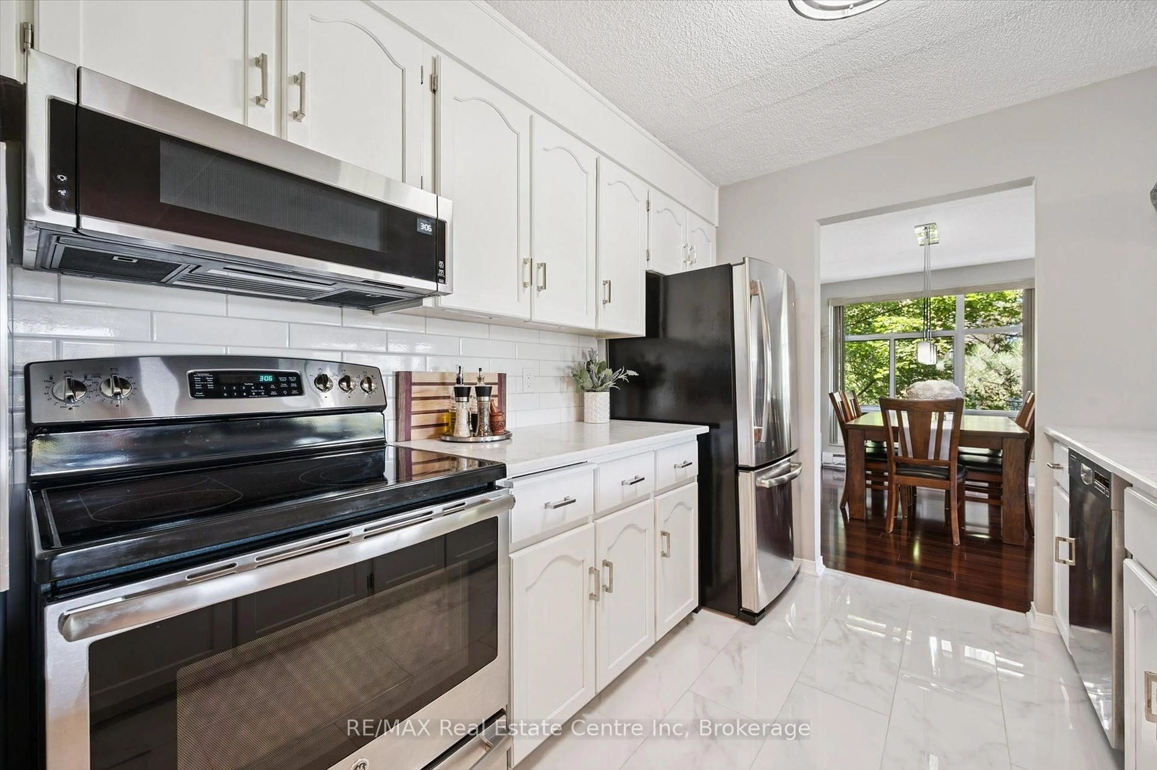 Open concept kitchen, ceramic/tile floor for 8 CHRISTOPHER Crt #306, Guelph Ontario N1G 4N7