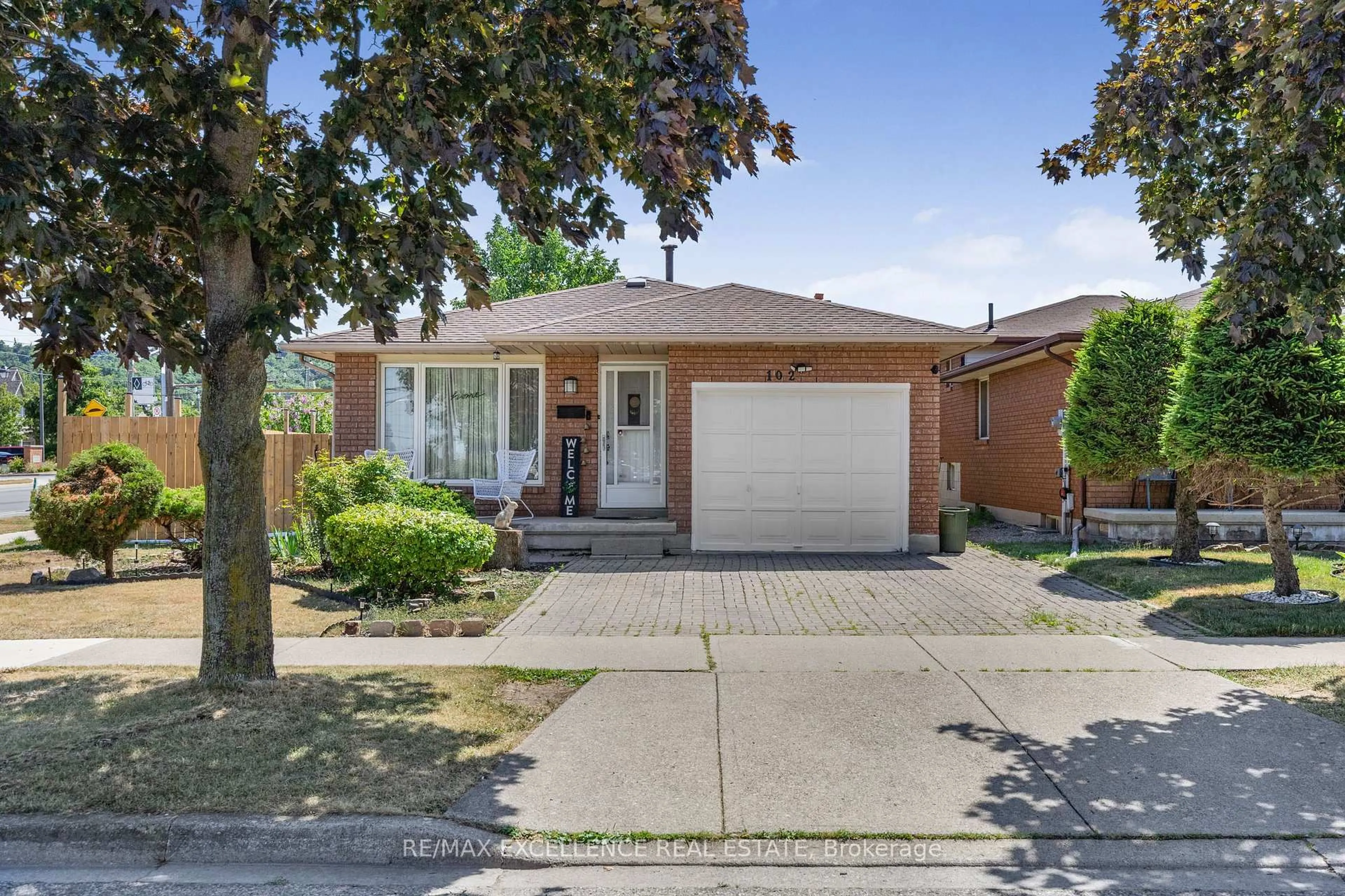 Home with brick exterior material, street for 102 Juniper Dr, Hamilton Ontario L8E 4G6