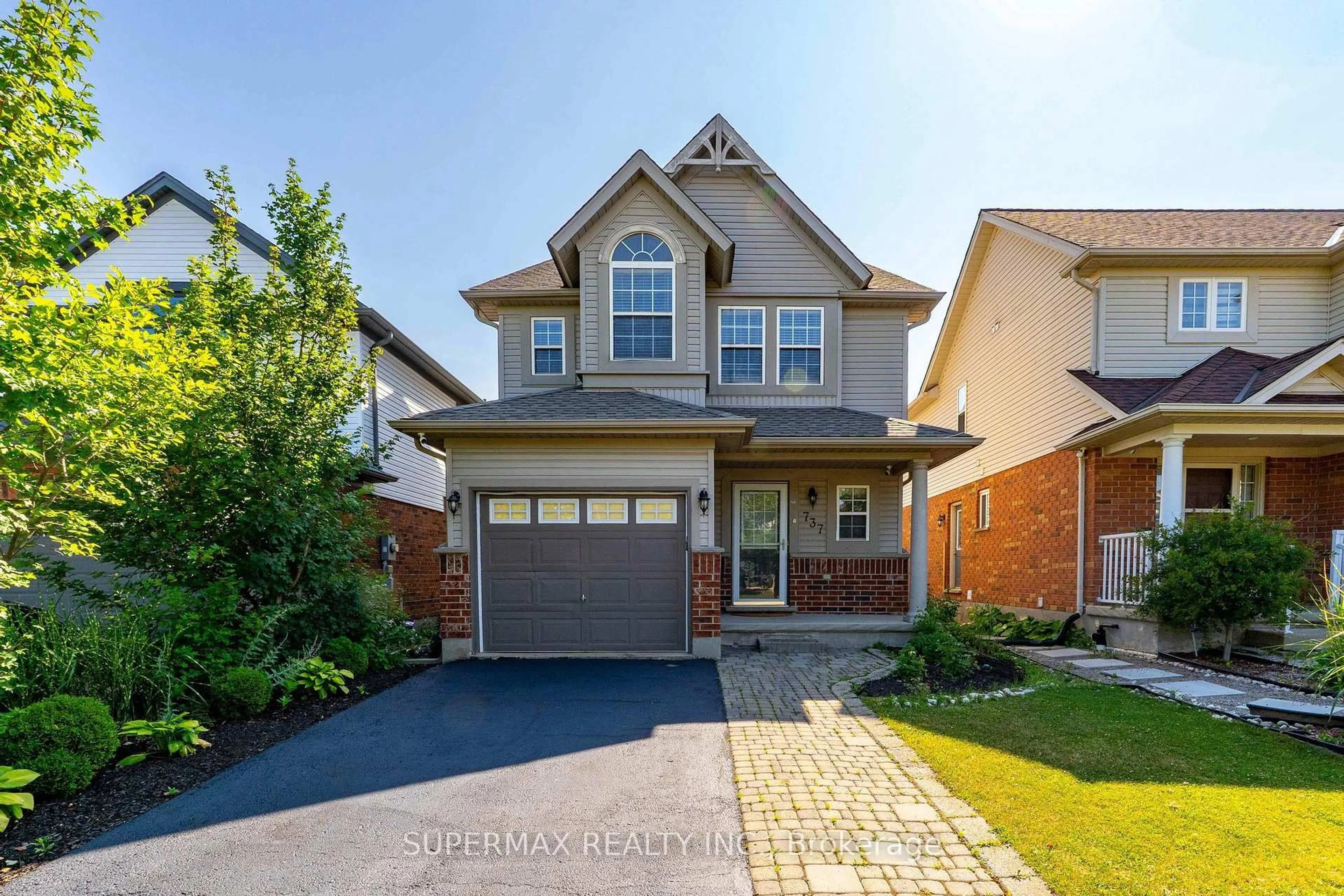 Home with brick exterior material, street for 737 Grand Banks Dr, Waterloo Ontario N2K 4N2