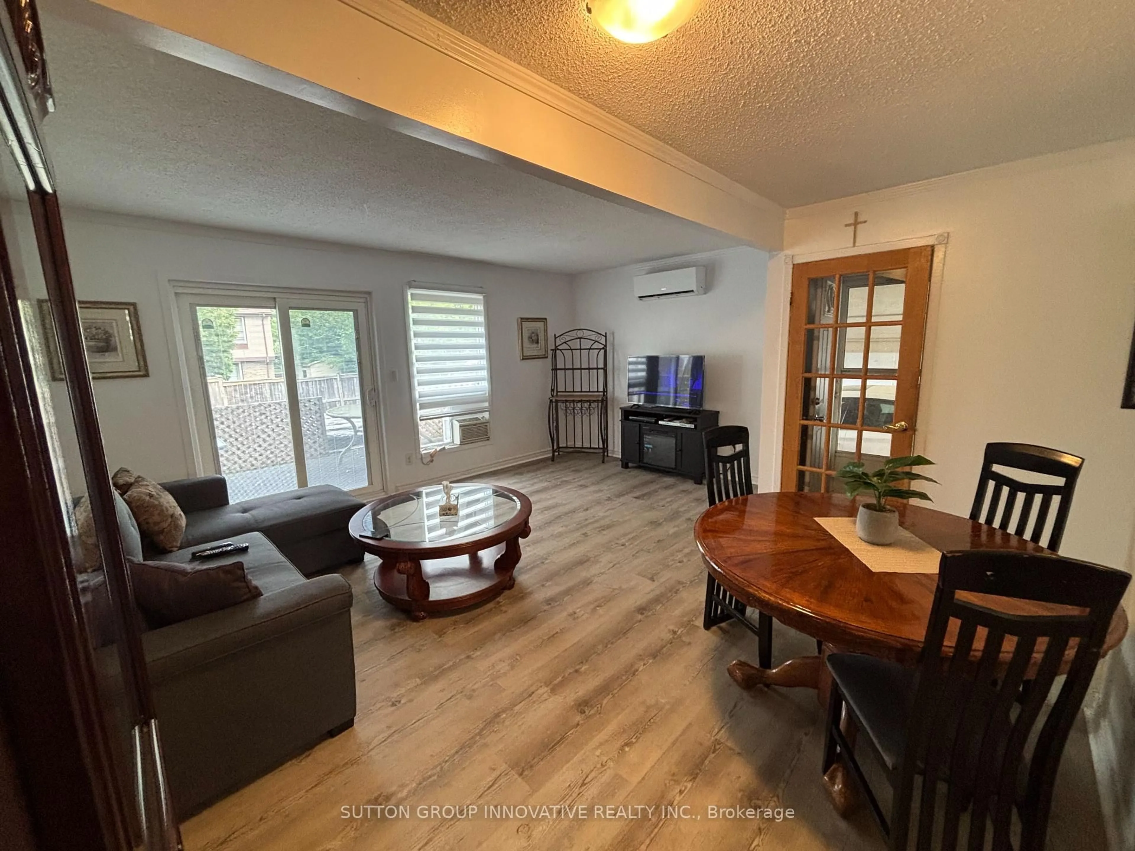 Living room with furniture, wood/laminate floor for 657 Upper Wentworth St, Hamilton Ontario L9A 4V4
