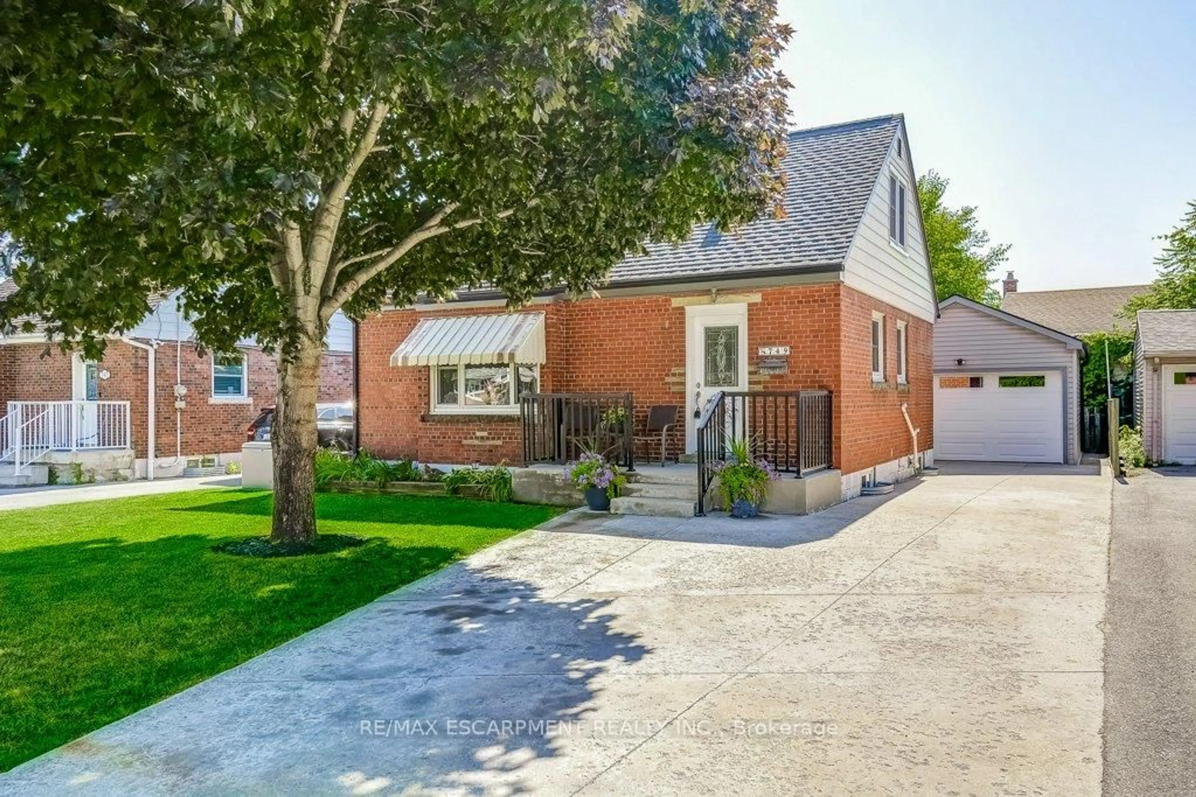 Home with brick exterior material, street for 749 Upper Gage Ave, Hamilton Ontario L8V 4J9