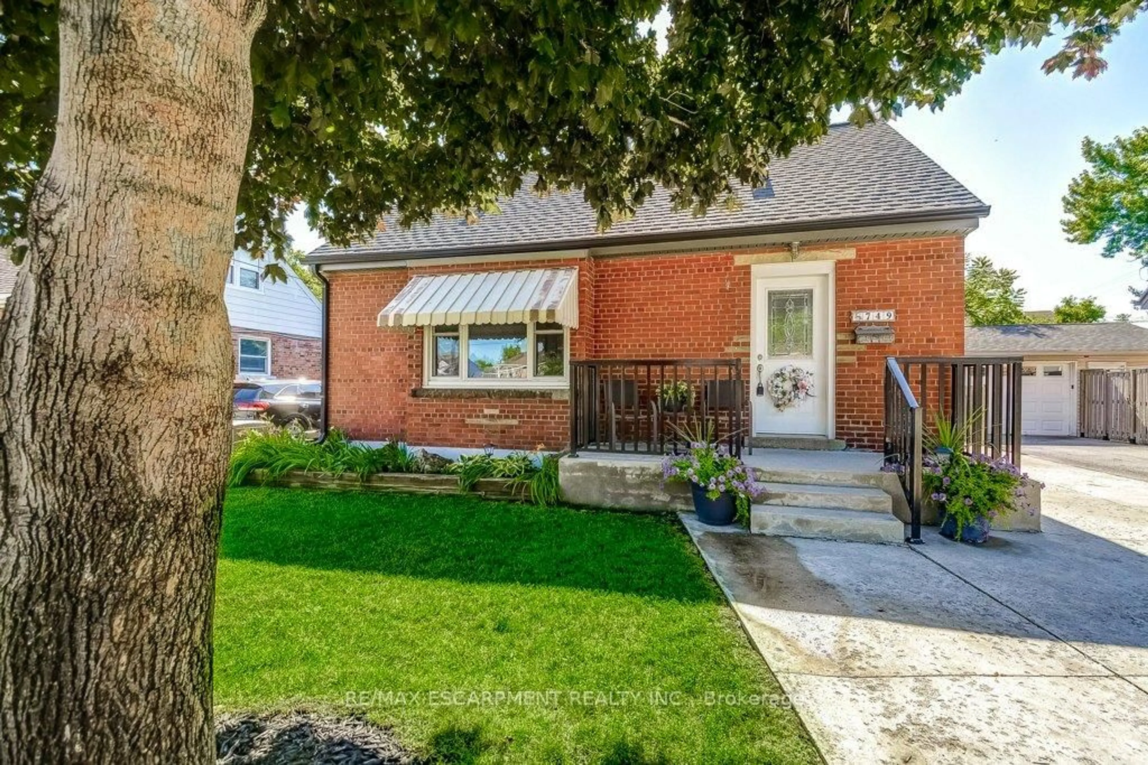 Home with brick exterior material, street for 749 Upper Gage Ave, Hamilton Ontario L8V 4J9