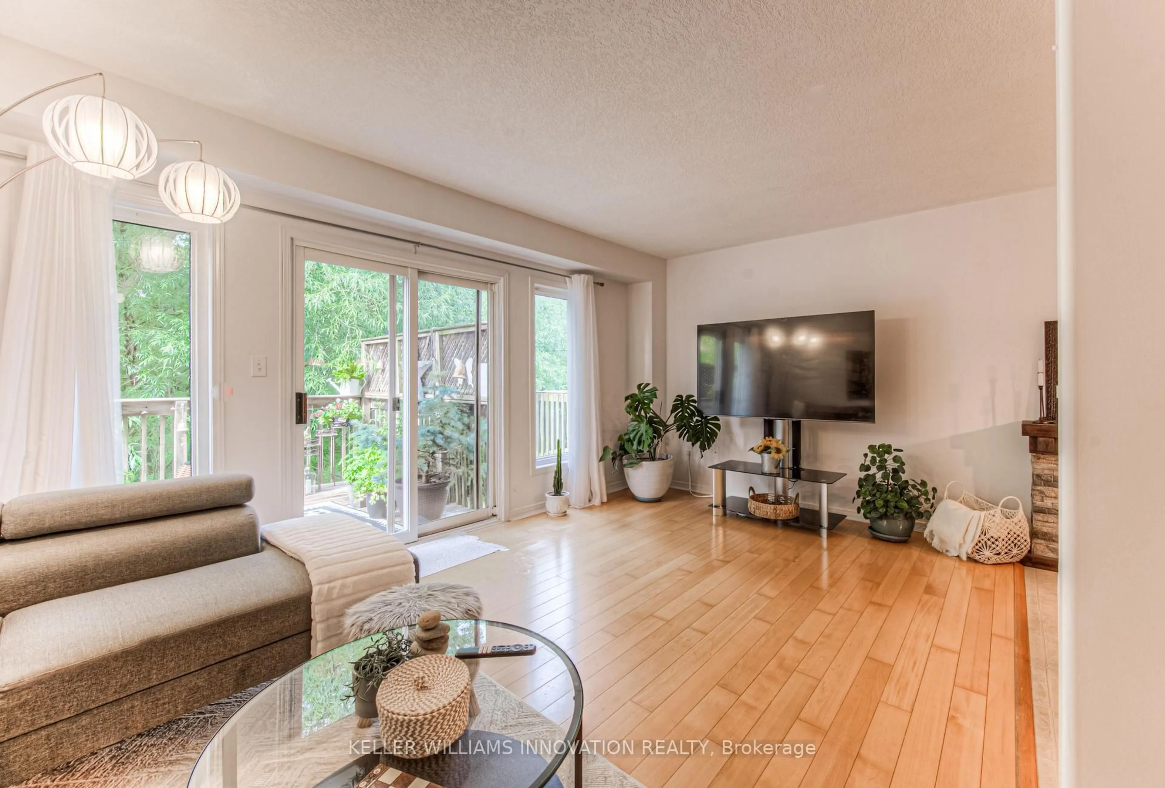 Living room with furniture, wood/laminate floor for 85 Bankside Dr #F37, Kitchener Ontario N2N 3M4