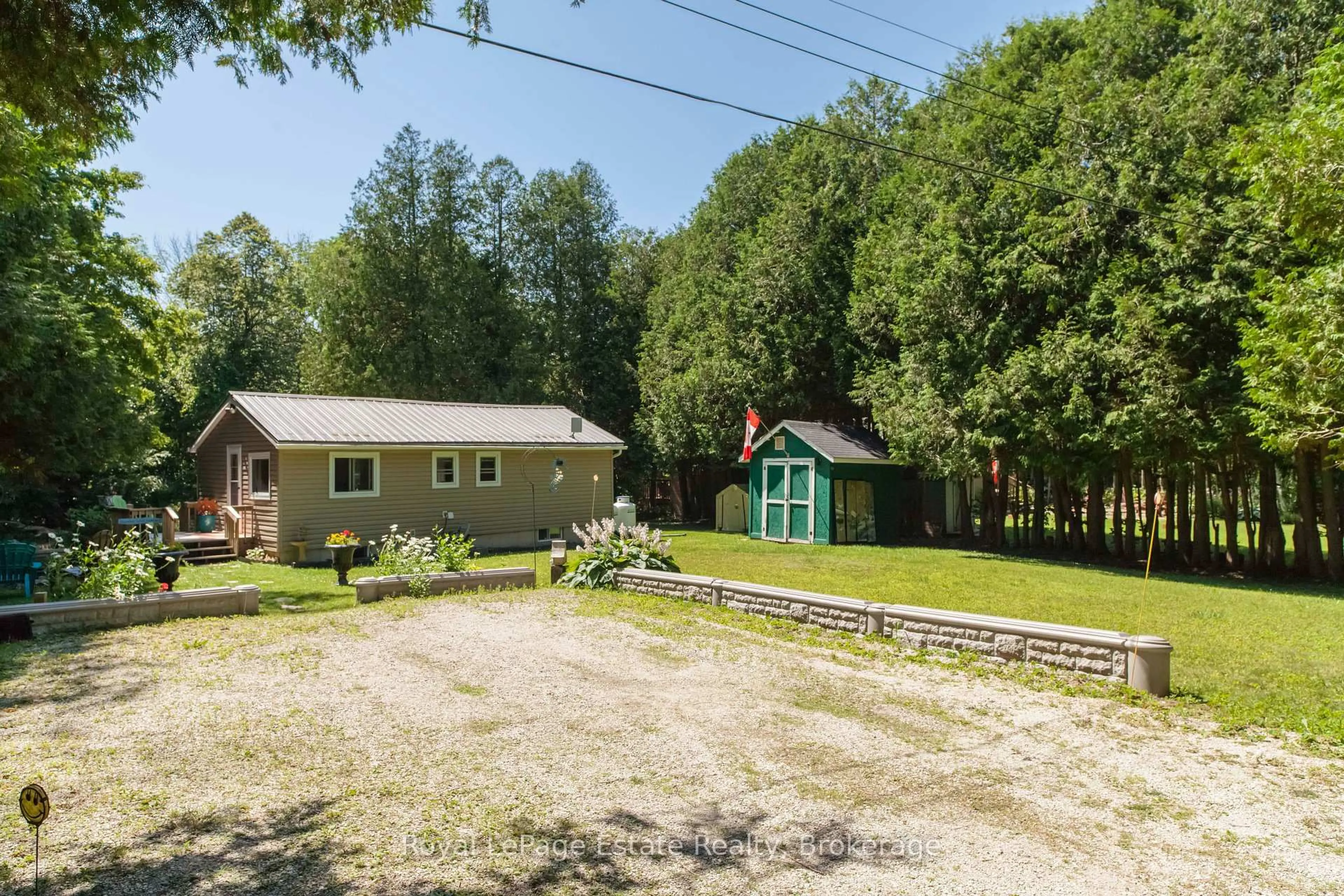 A pic from outside/outdoor area/front of a property/back of a property/a pic from drone, unknown for 50 Roger's Cres, South Bruce Peninsula Ontario N0H 1P0