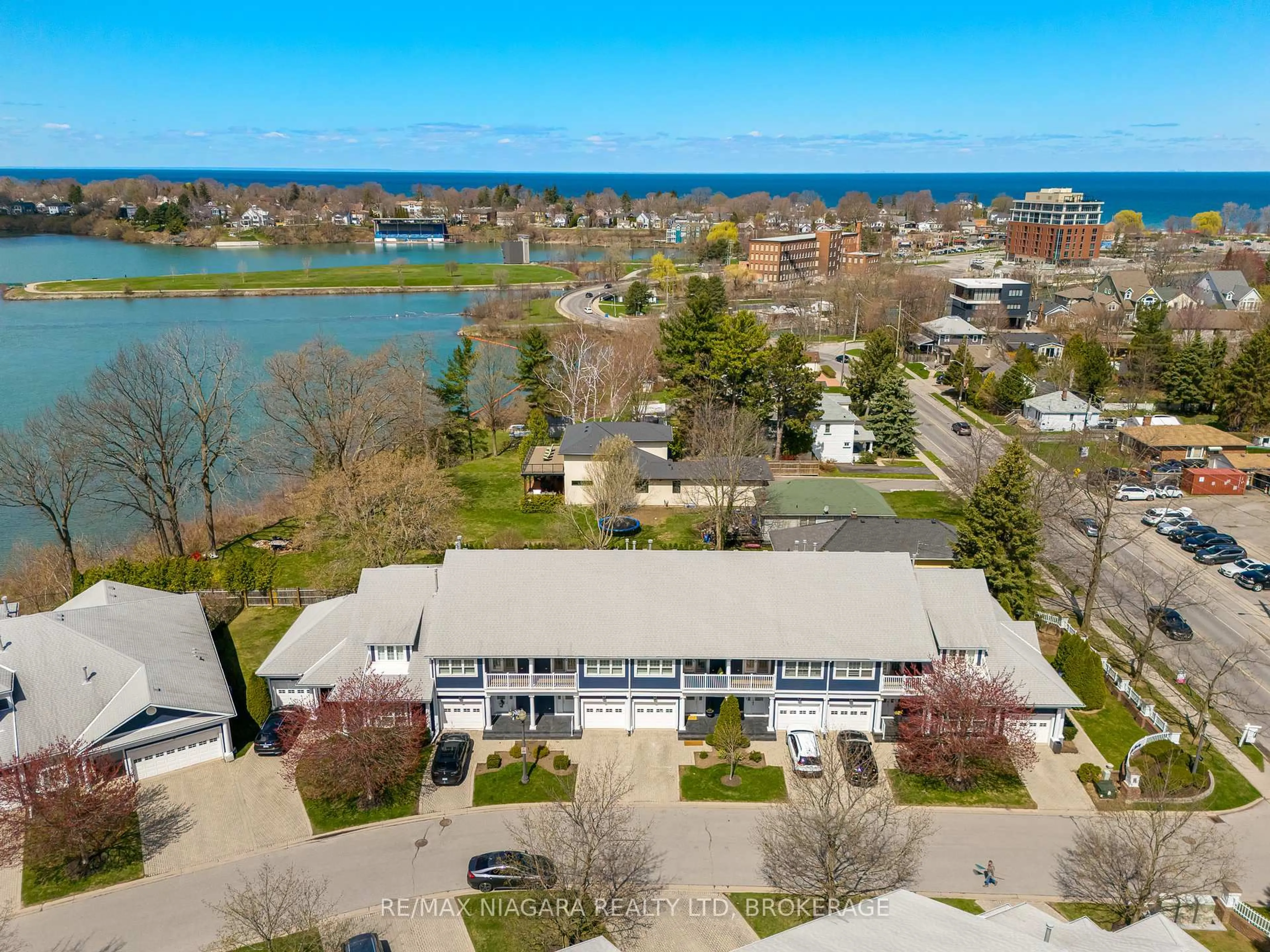 A pic from outside/outdoor area/front of a property/back of a property/a pic from drone, water/lake/river/ocean view for 88 Lakeport Rd #4, St. Catharines Ontario L2N 4P8