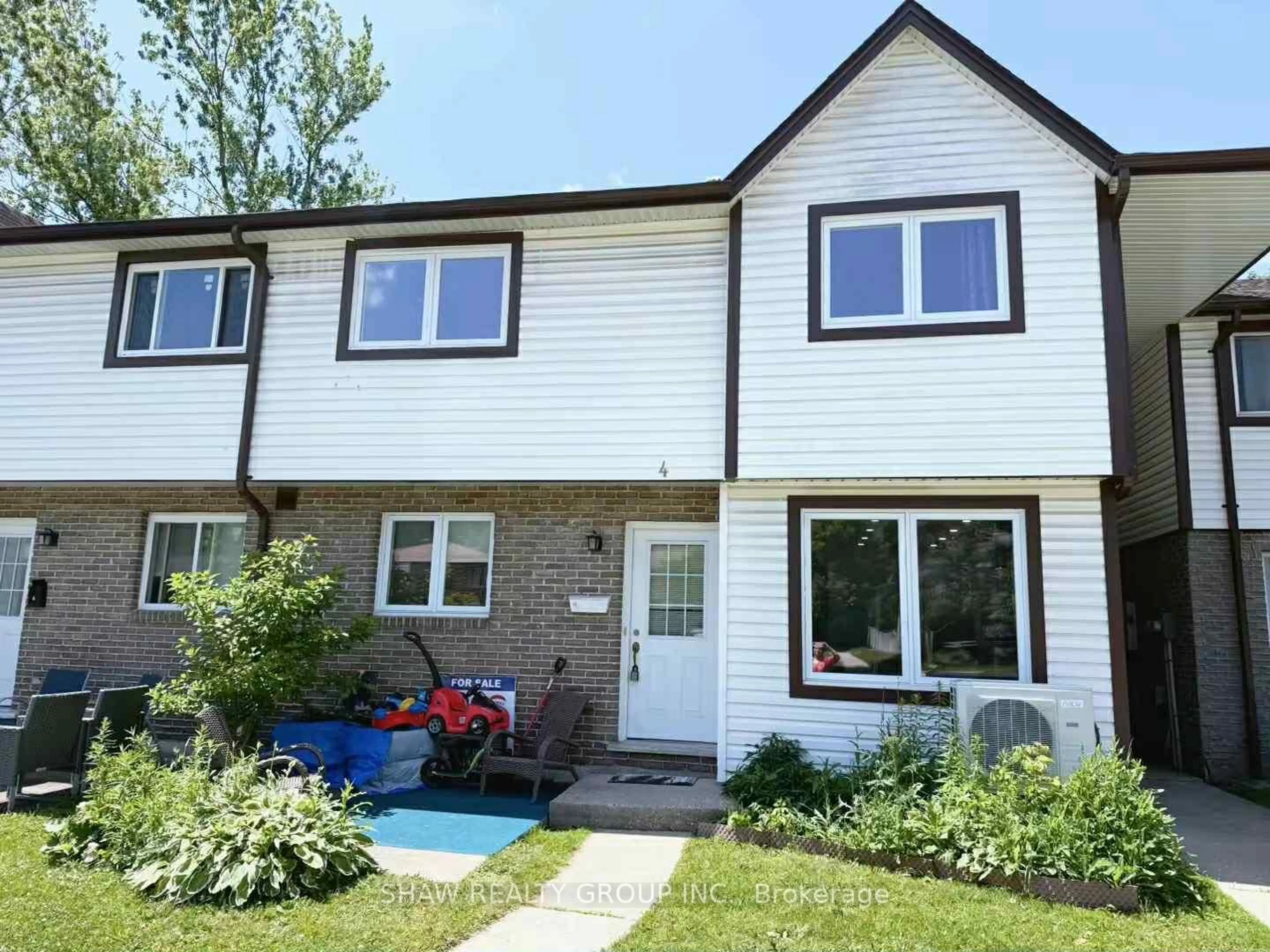 Home with vinyl exterior material, street for 445 Pioneer Dr #4, Kitchener Ontario N2P 1L8