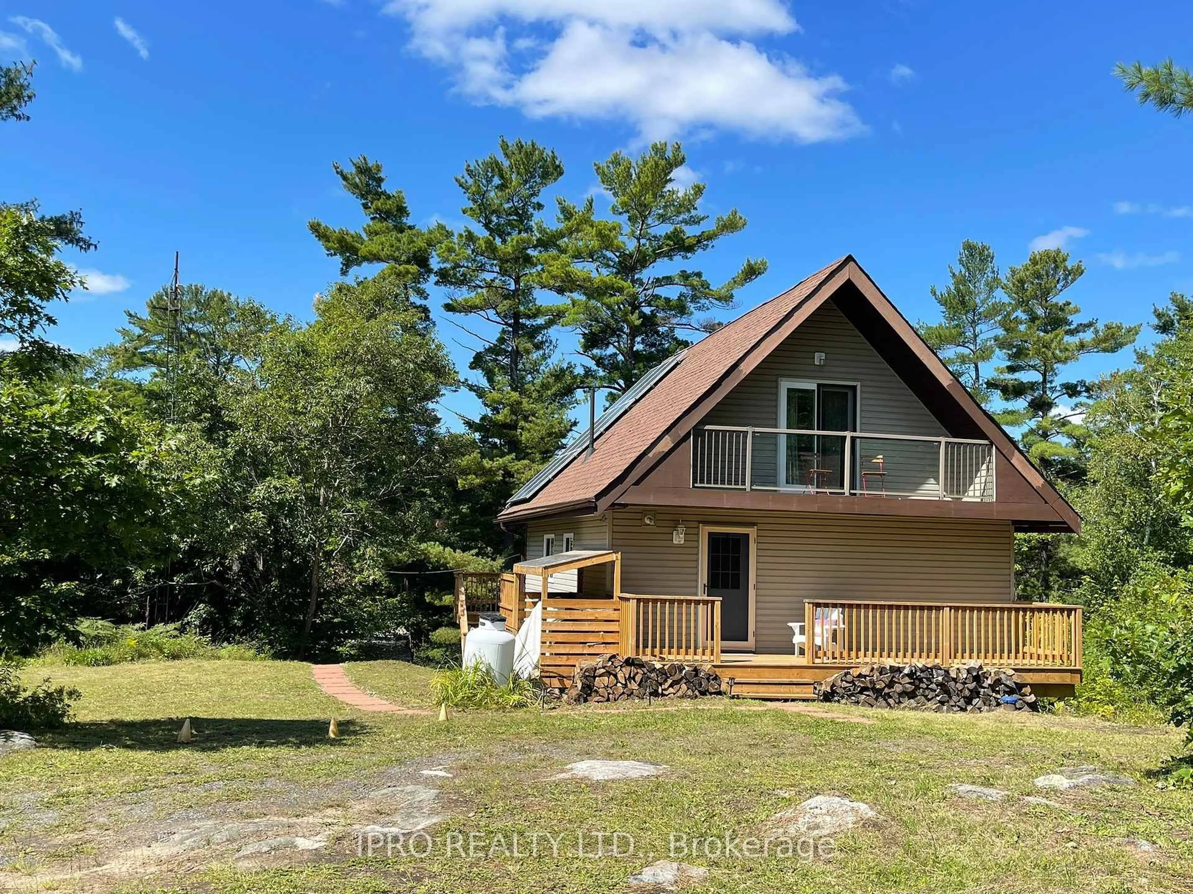 A pic from outside/outdoor area/front of a property/back of a property/a pic from drone, water/lake/river/ocean view for 794 HWY 518, Seguin Ontario P2A 2W9