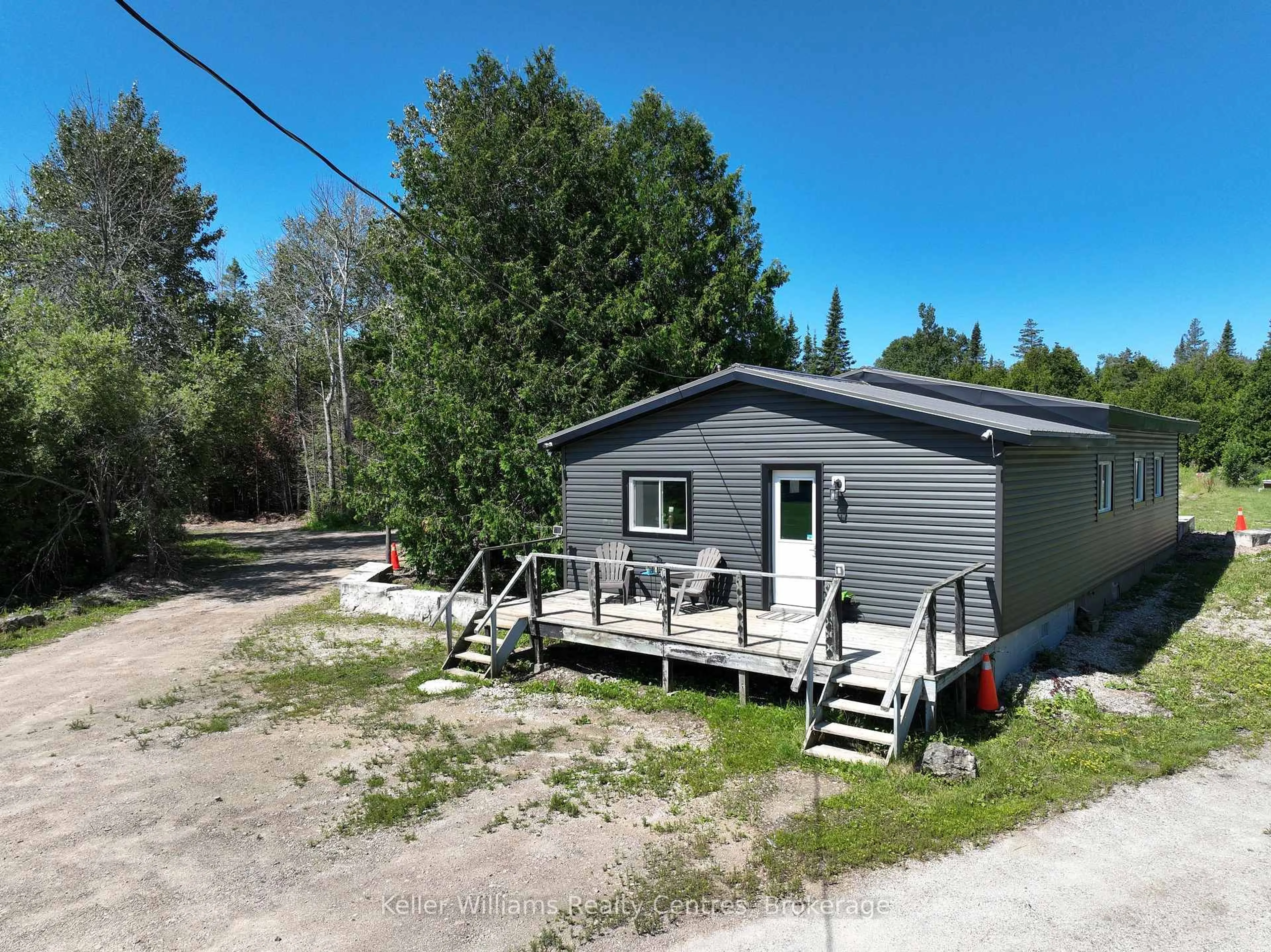 A pic from outside/outdoor area/front of a property/back of a property/a pic from drone, unknown for 23 Stokes Bay Rd, Northern Bruce Peninsula Ontario N0H 1W0