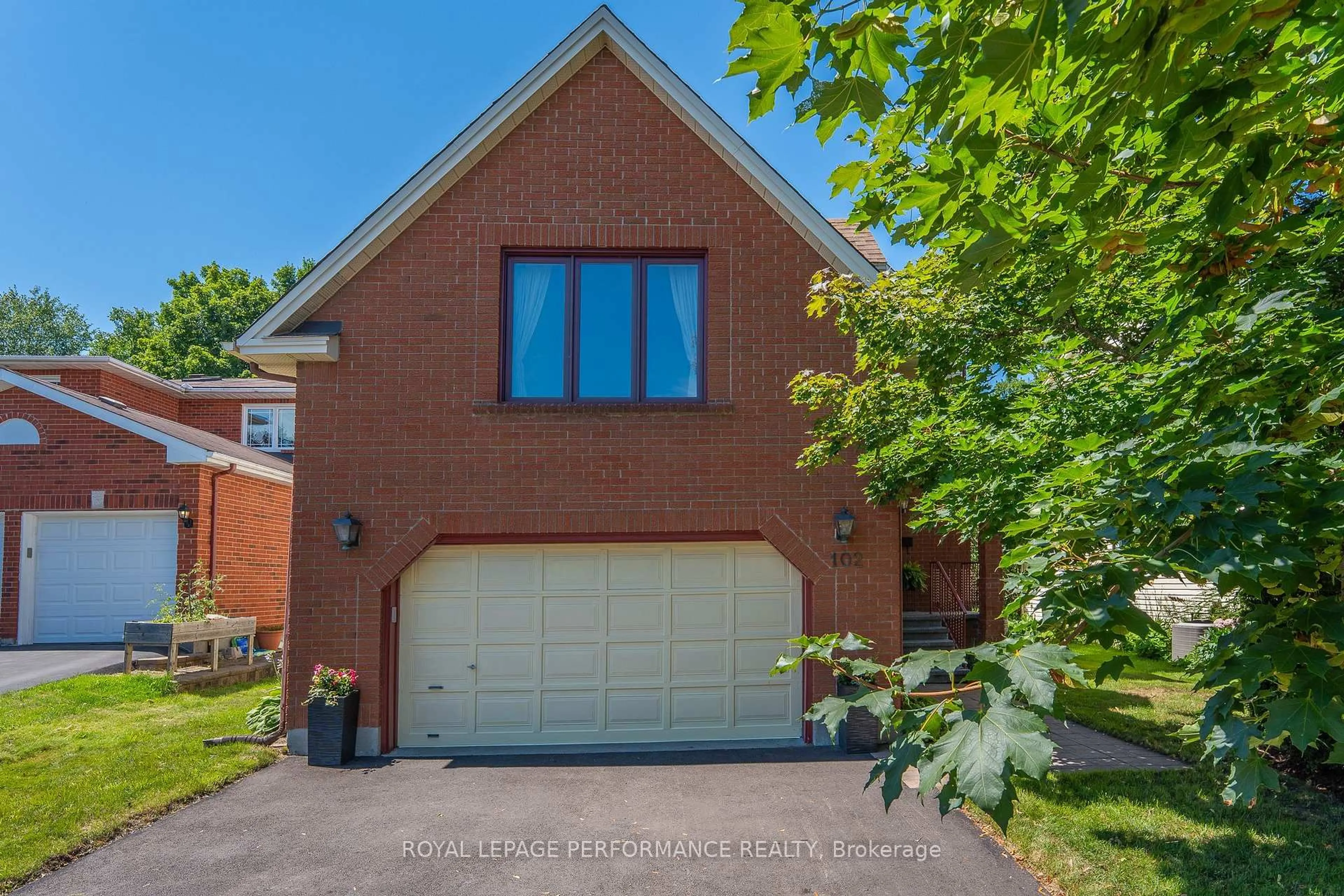 Home with brick exterior material, street for 102 Shearer Cres, Kanata Ontario K2L 3W1