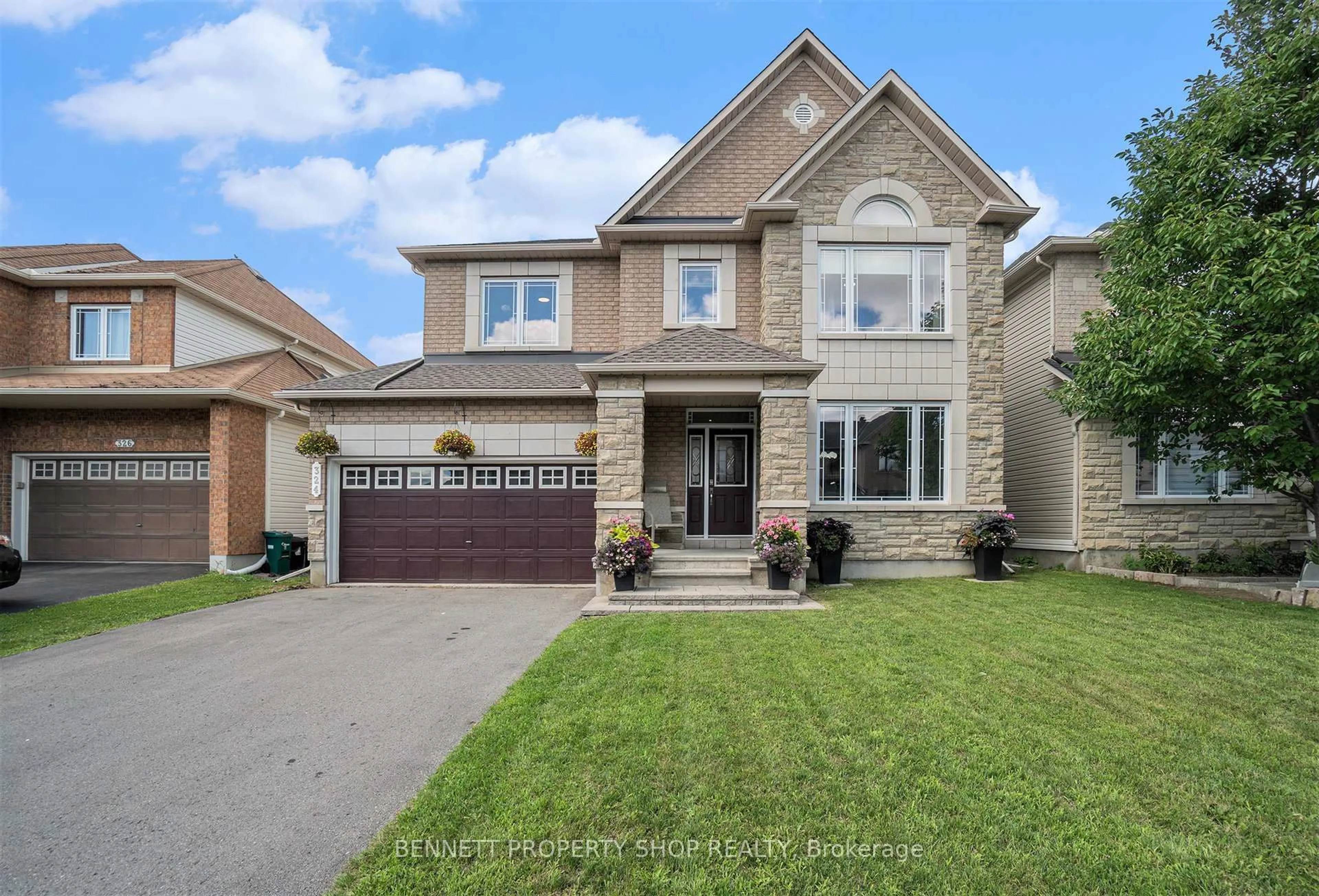 Home with brick exterior material, street for 324 Fairlakes Way, Ottawa Ontario K4A 0K8