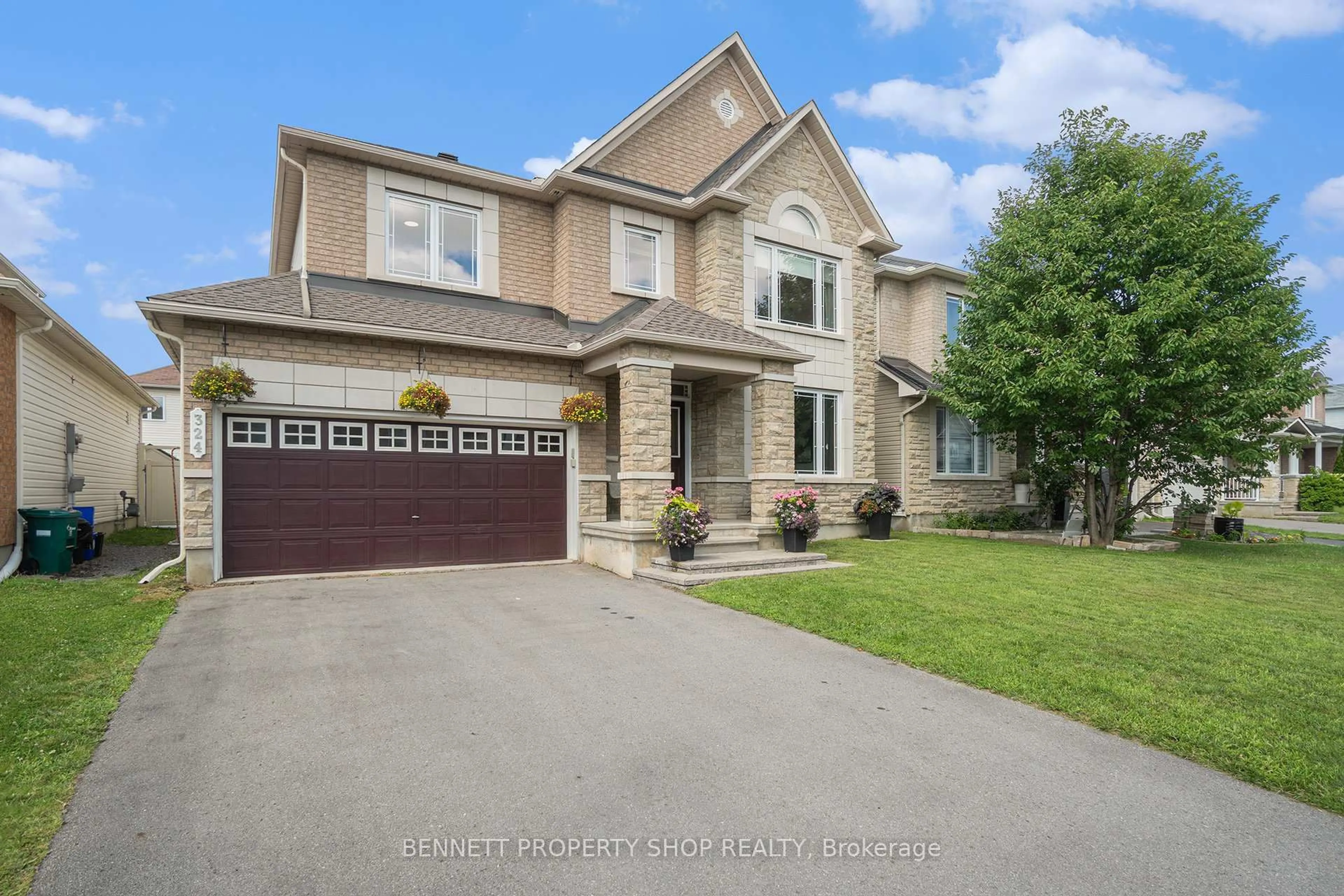 Home with brick exterior material, street for 324 Fairlakes Way, Ottawa Ontario K4A 0K8