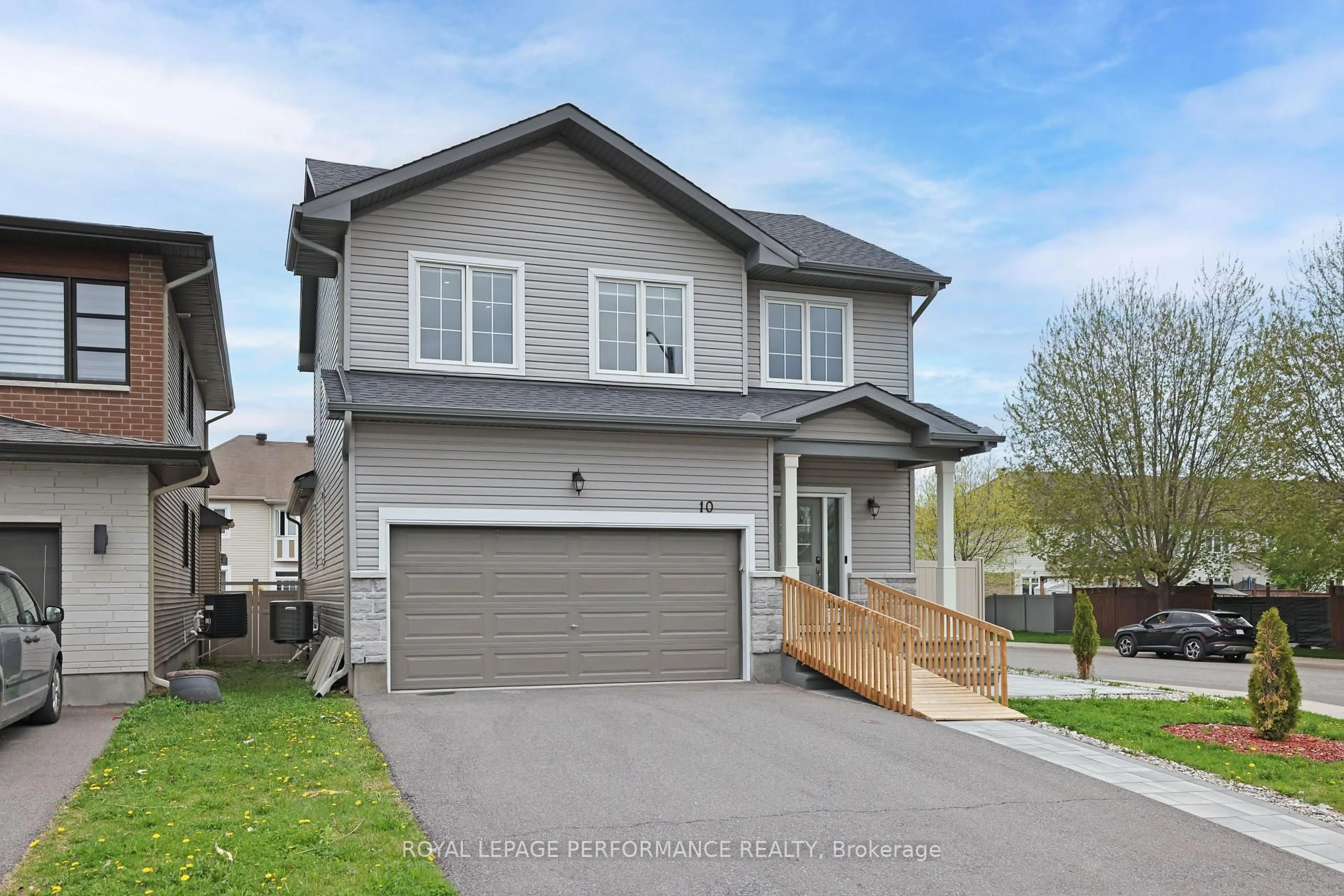Home with vinyl exterior material, street for 10 Kinetic Way, Ottawa Ontario K2J 0C9