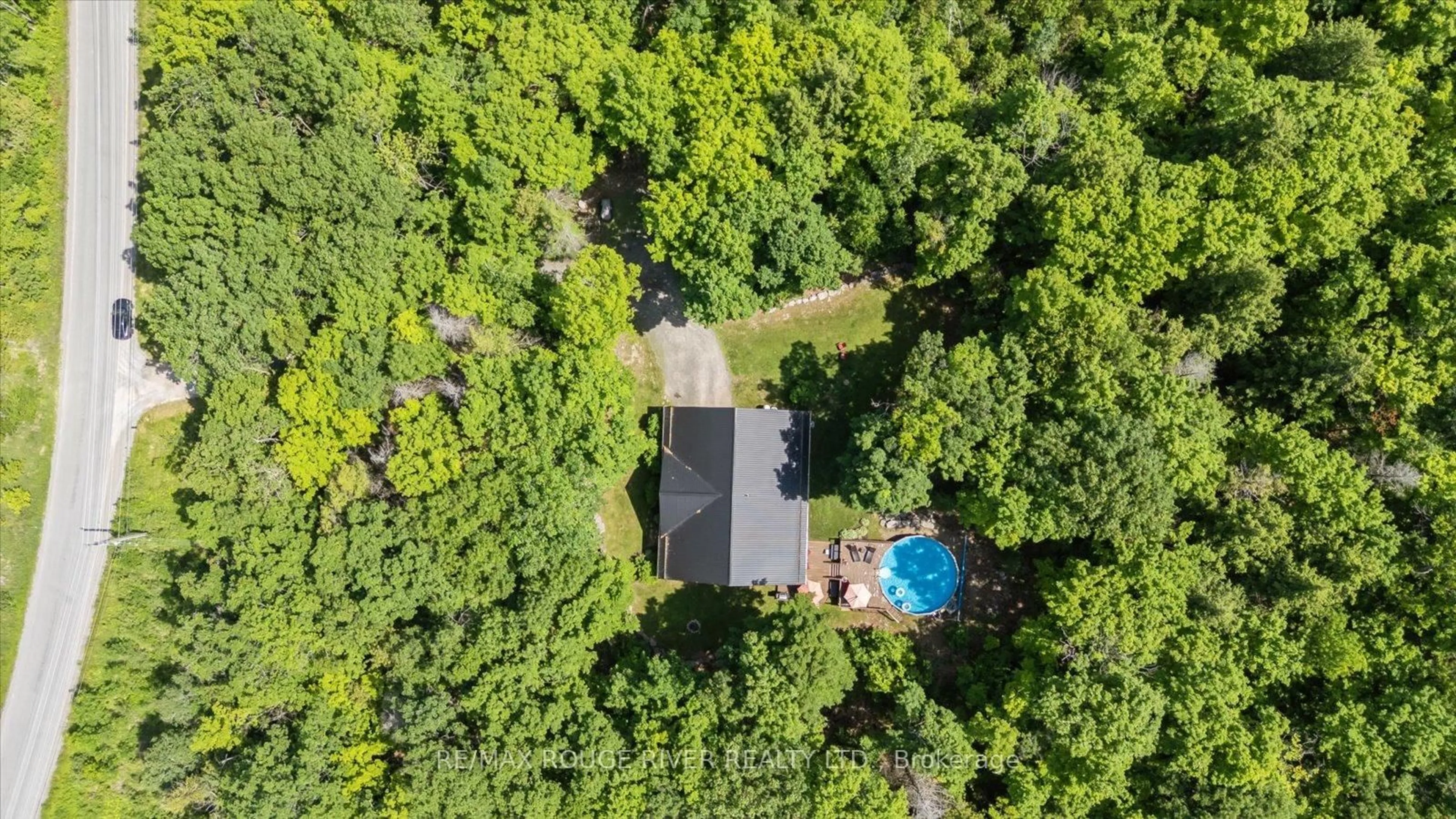 A pic from outside/outdoor area/front of a property/back of a property/a pic from drone, forest/trees view for 36 Station Rd, Limoges Ontario K0K 2M0