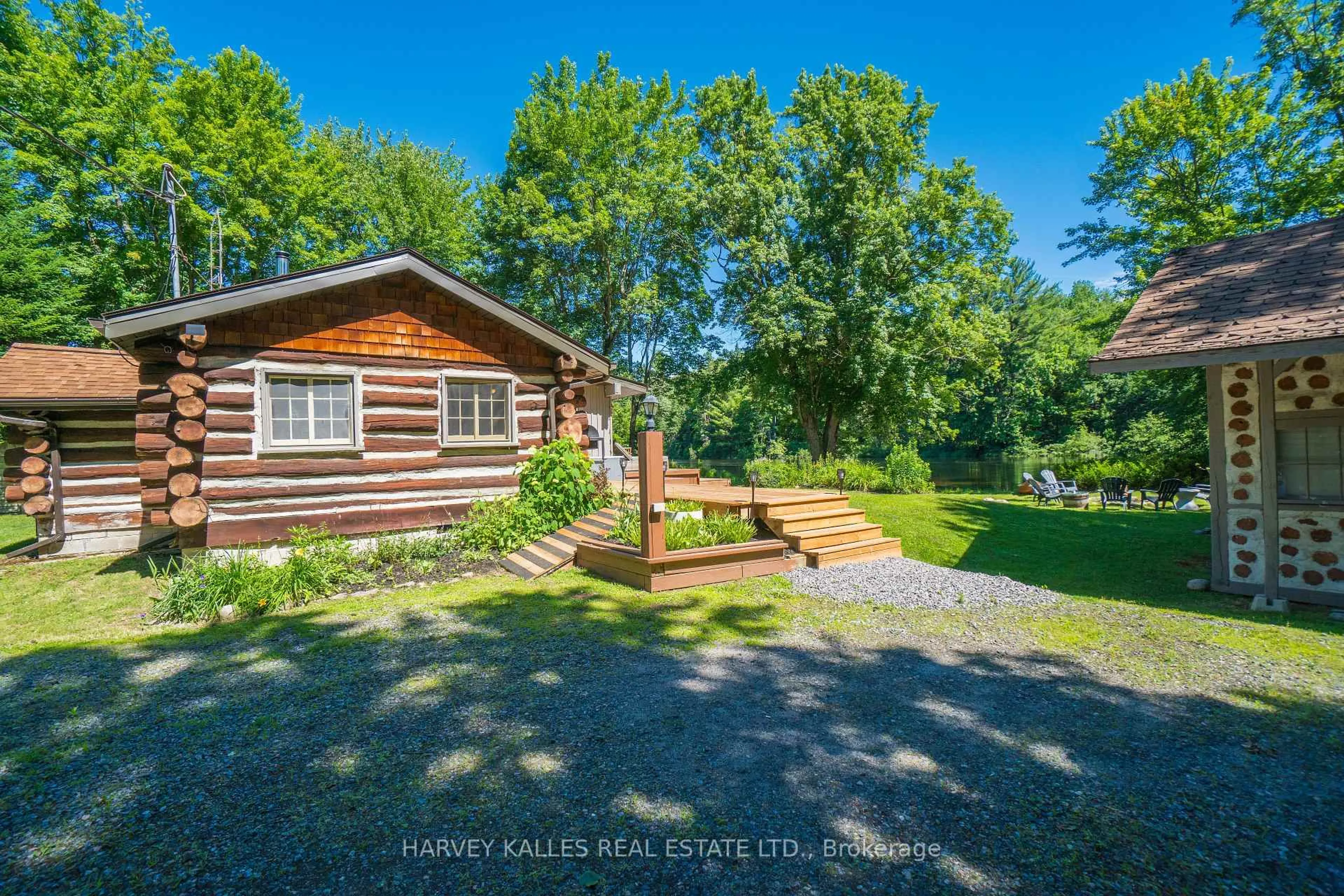 A pic from outside/outdoor area/front of a property/back of a property/a pic from drone, water/lake/river/ocean view for 1053 Sherwood Forest Rd, Bracebridge Ontario P1L 1X3