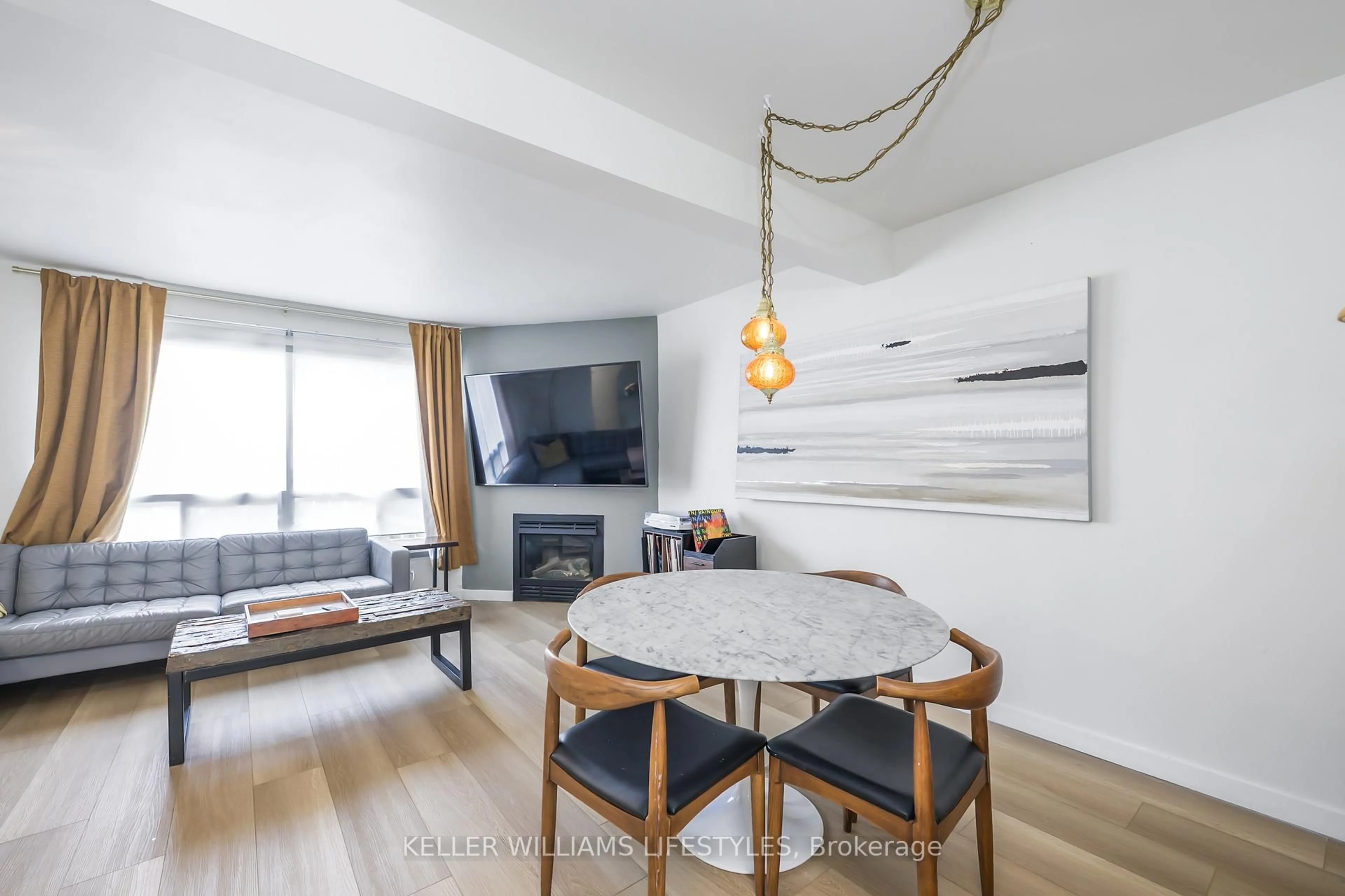 Living room with furniture, wood/laminate floor for 126 Belmont Dr #7, London South Ontario N6J 4W1