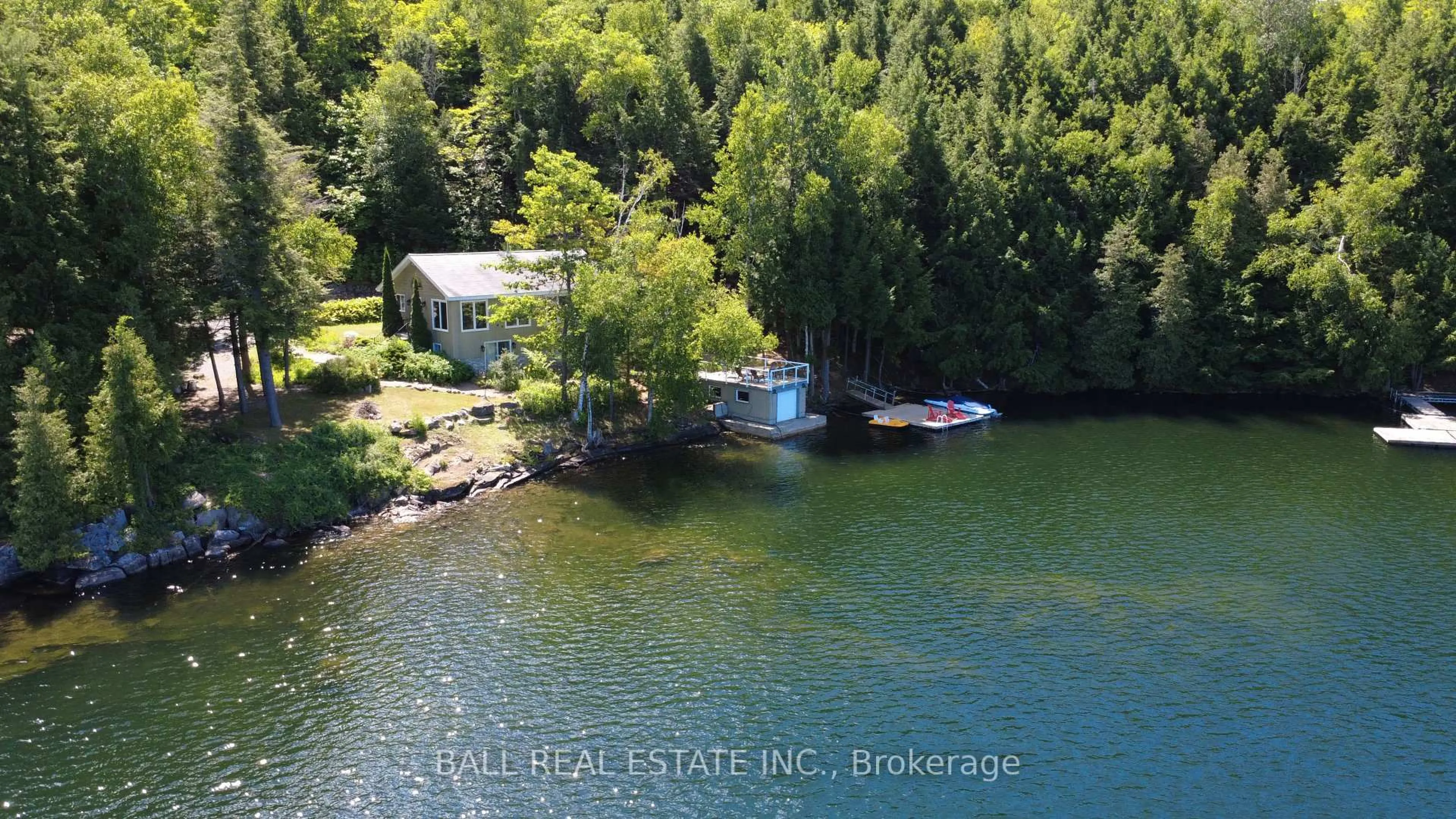 A pic from outside/outdoor area/front of a property/back of a property/a pic from drone, water/lake/river/ocean view for 55 Kingfisher Lane, North Kawartha Ontario K0L 1A0