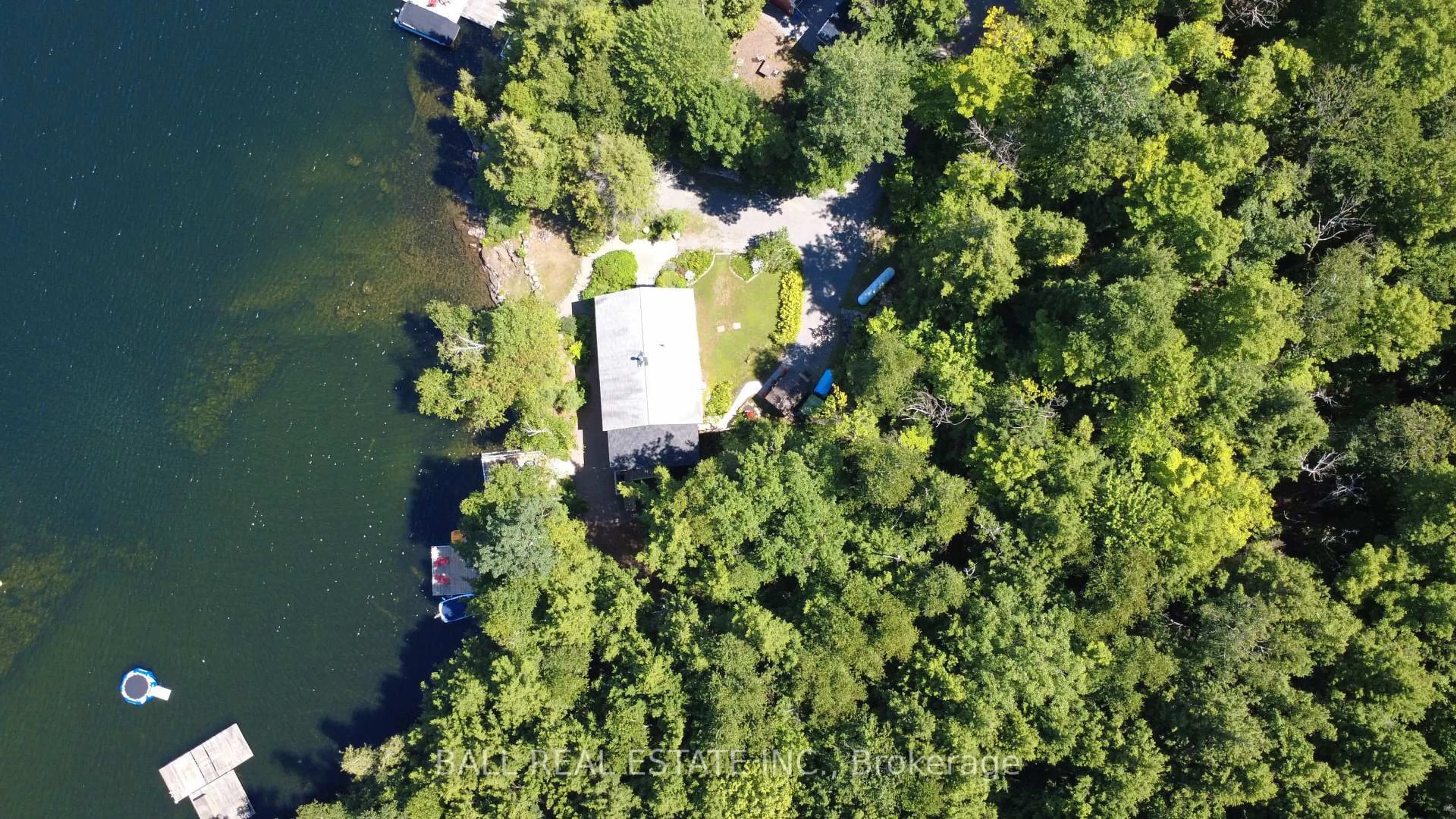 A pic from outside/outdoor area/front of a property/back of a property/a pic from drone, water/lake/river/ocean view for 55 Kingfisher Lane, North Kawartha Ontario K0L 1A0