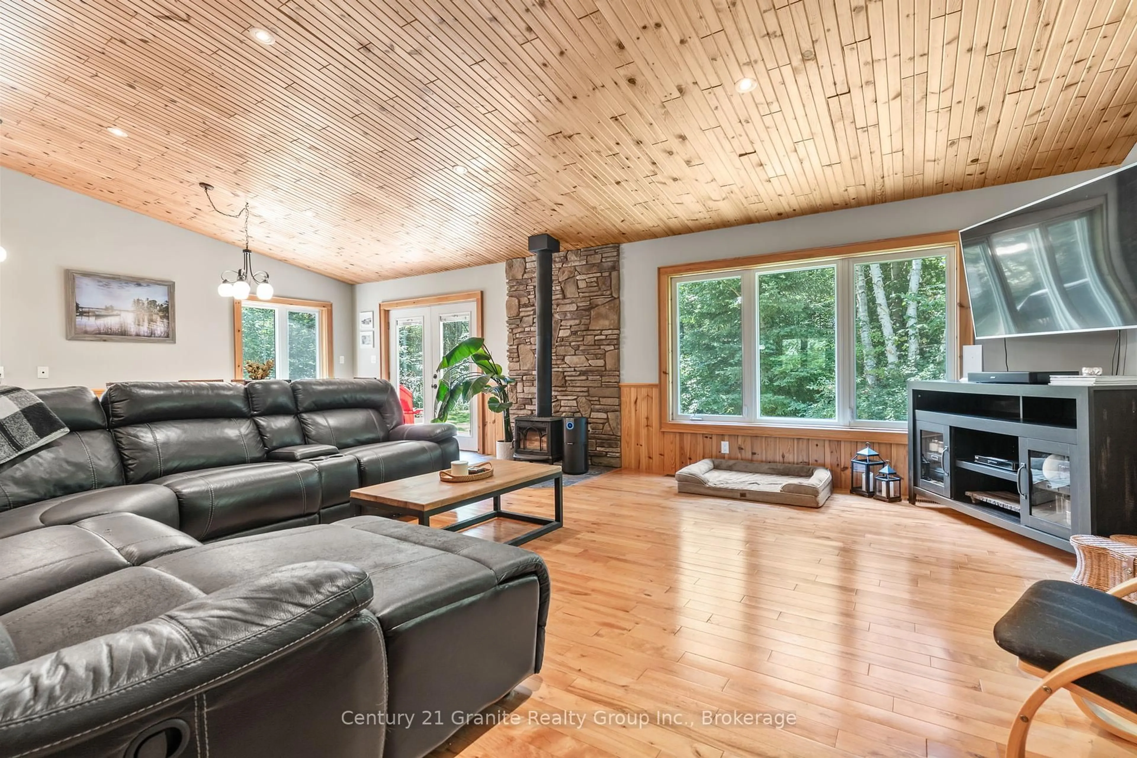 Living room with furniture, wood/laminate floor for 1012 Redner Rd, Algonquin Highlands Ontario K0M 1S0