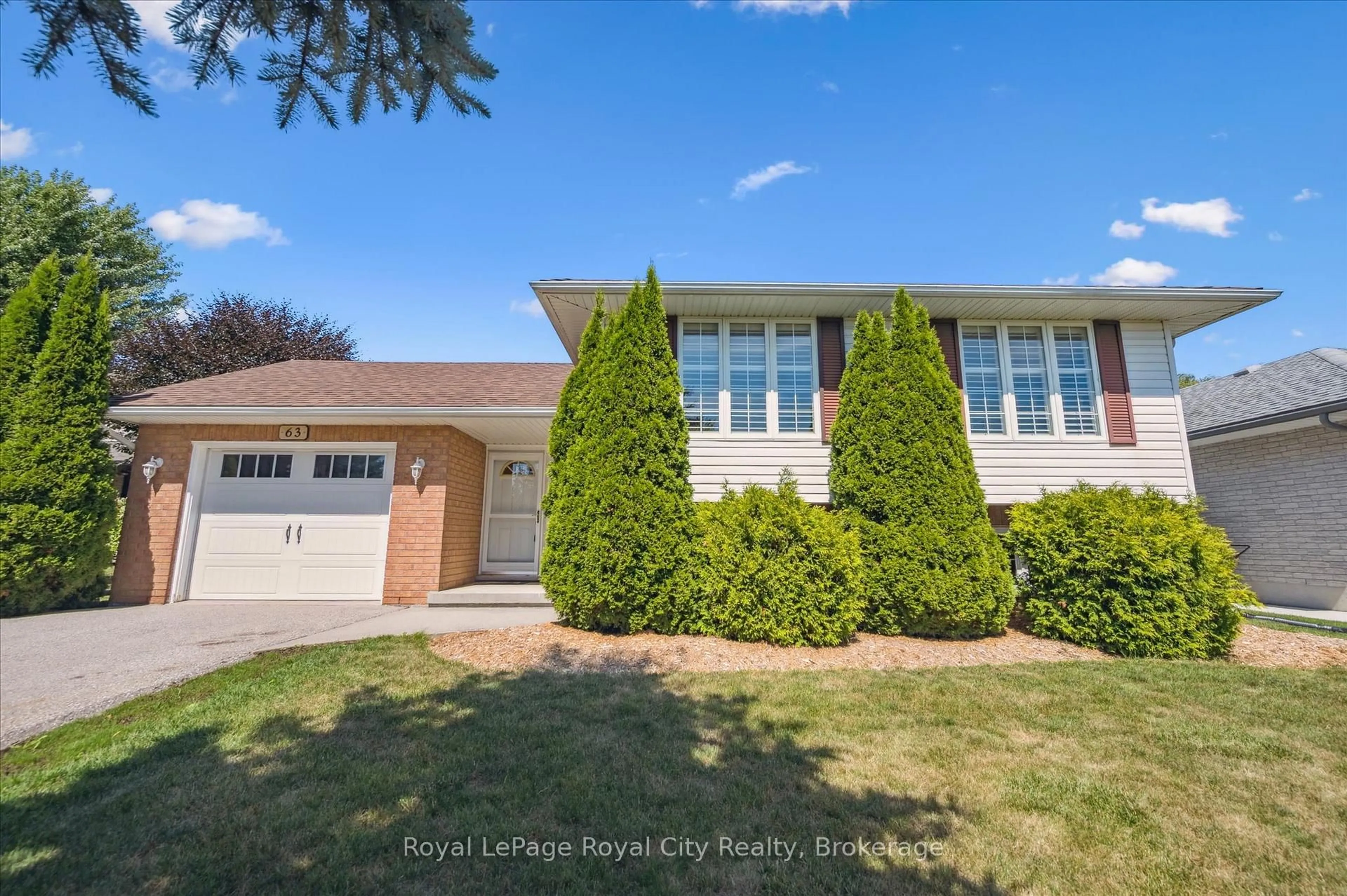 Home with vinyl exterior material, street for 63 Thomas Blvd, Centre Wellington Ontario N0B 1S0