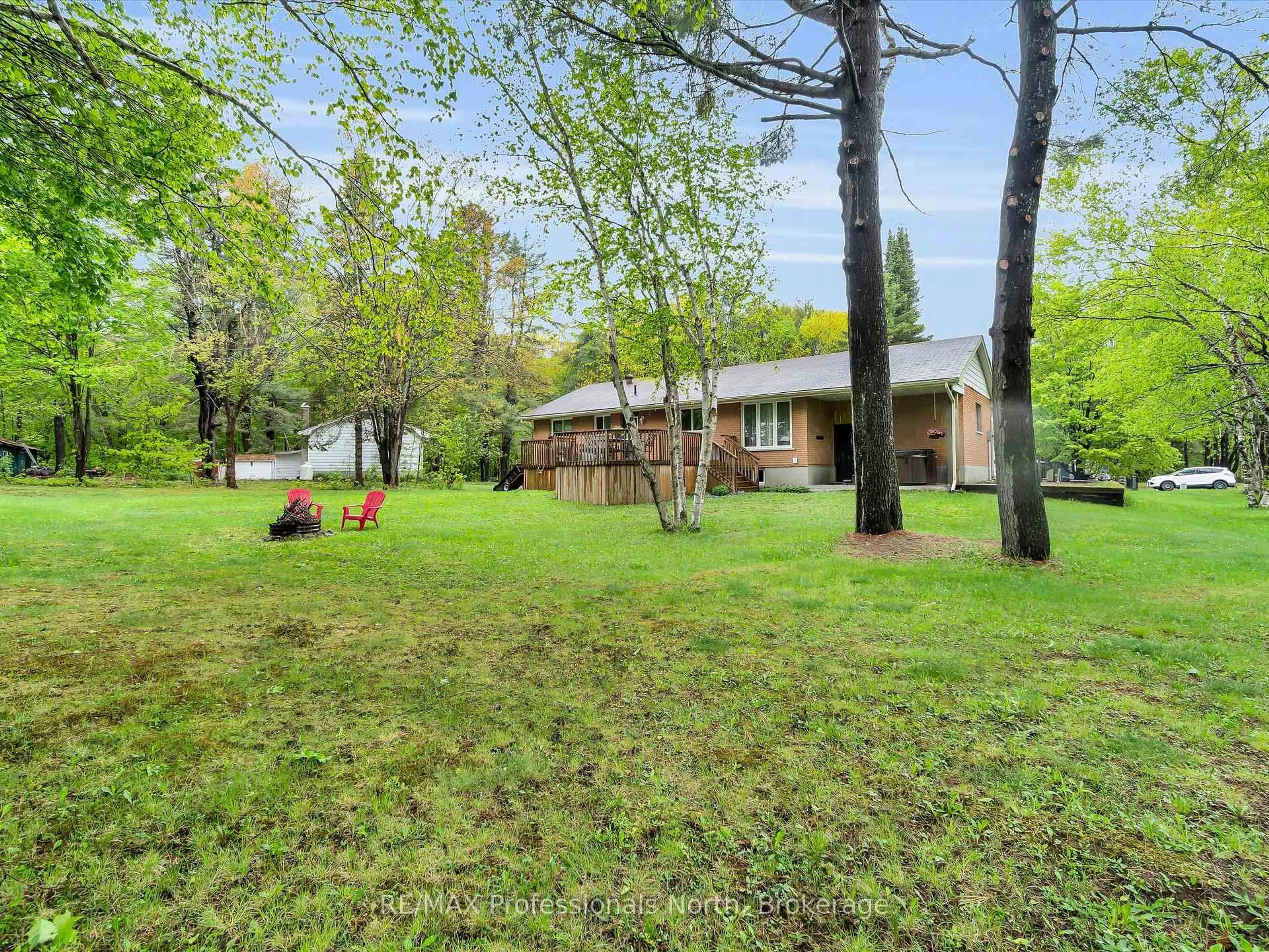 A pic from outside/outdoor area/front of a property/back of a property/a pic from drone, forest/trees view for 9 Beacon Lane, Bracebridge Ontario P1L 1L6