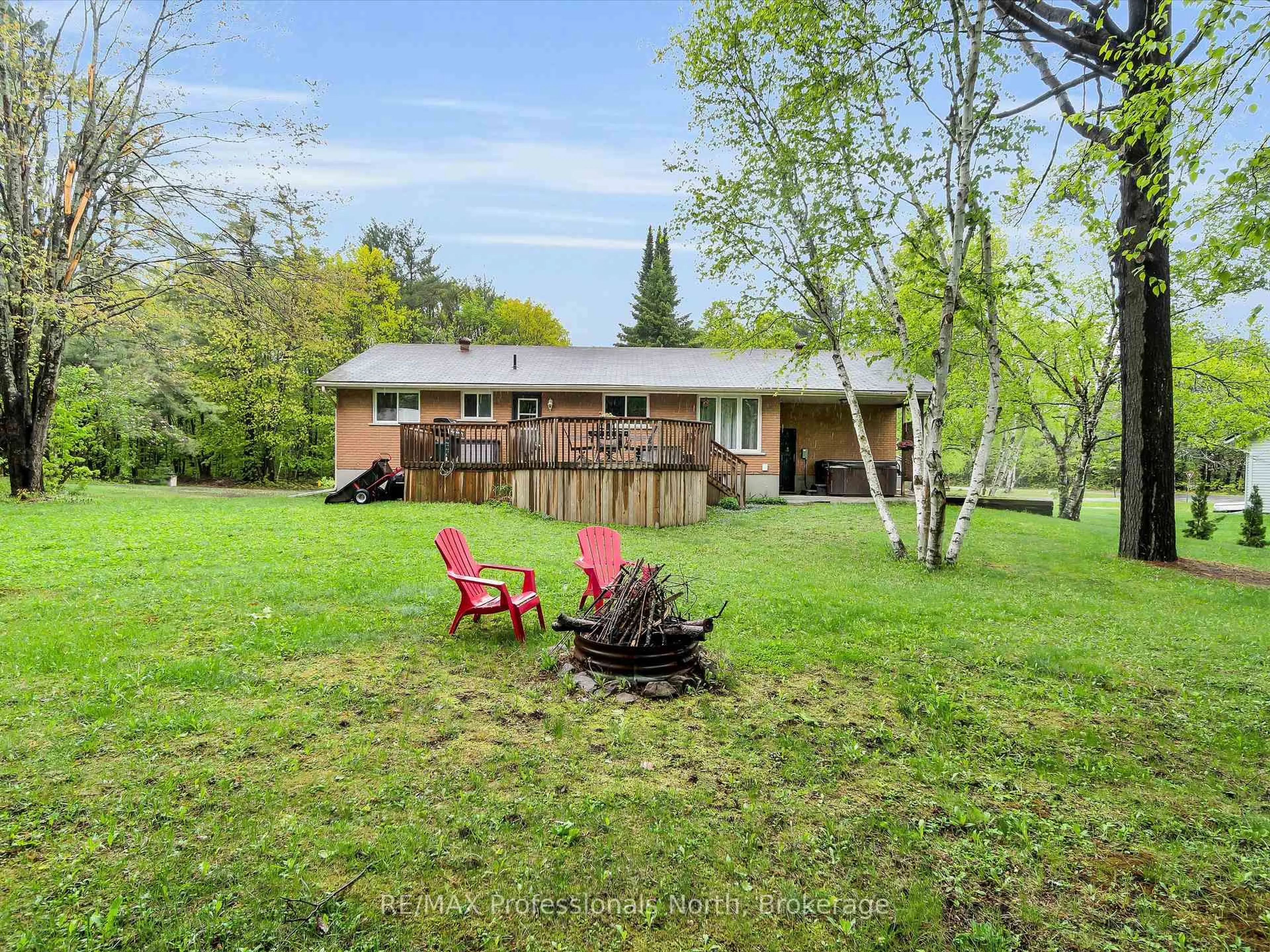 A pic from outside/outdoor area/front of a property/back of a property/a pic from drone, water/lake/river/ocean view for 9 Beacon Lane, Bracebridge Ontario P1L 1L6