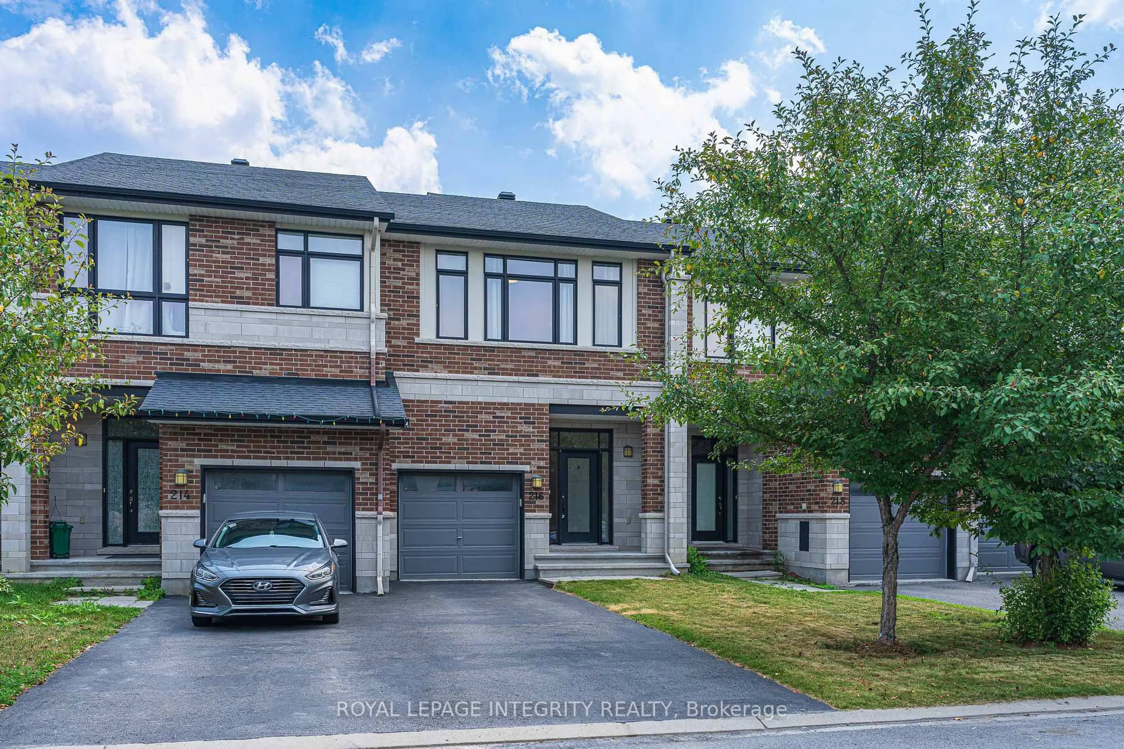 Home with brick exterior material, street for 216 Cooks Mill Cres, Ottawa Ontario K1V 2N1