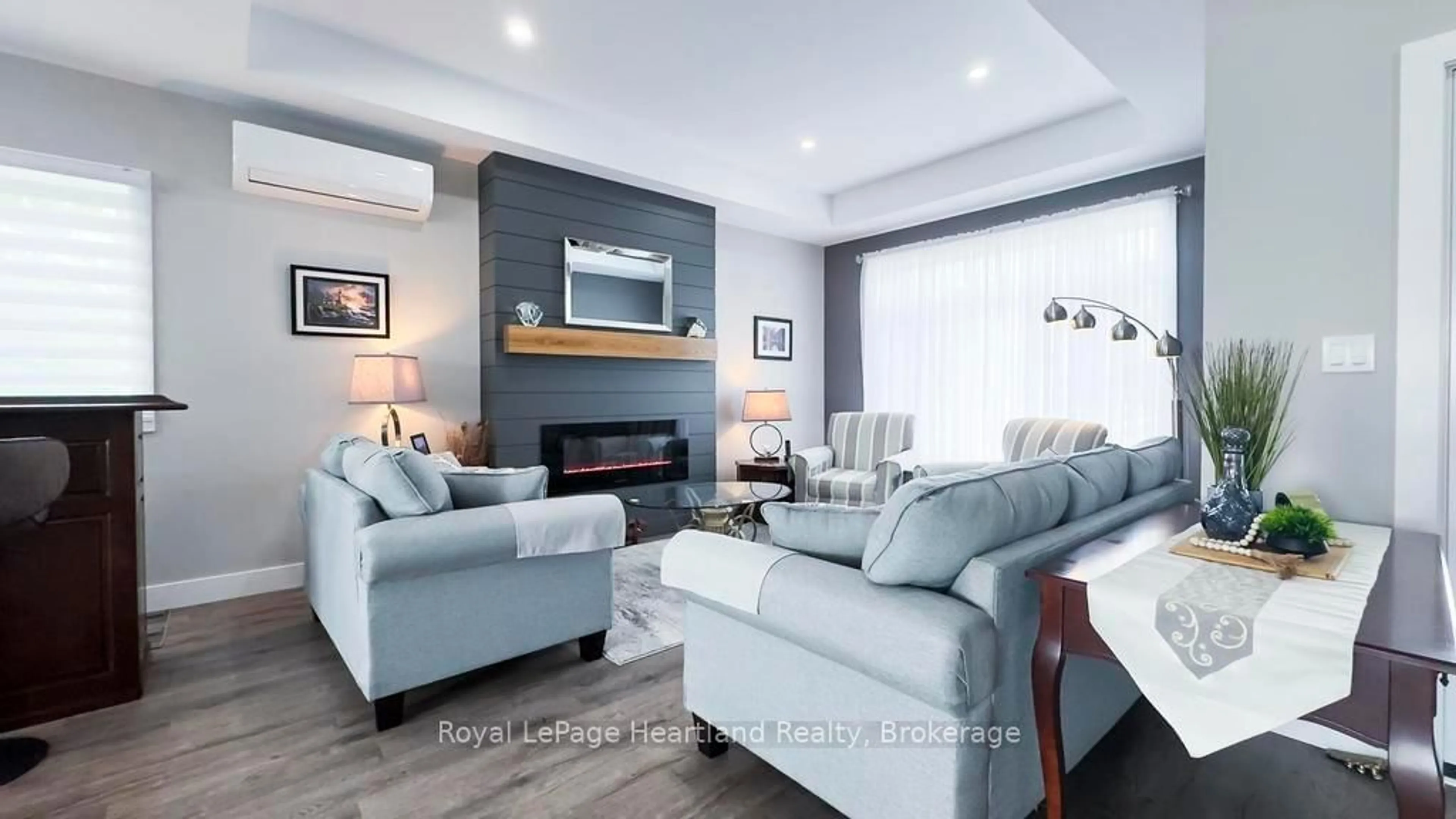 Living room with furniture, wood/laminate floor for 648 Gloria St, North Huron Ontario N0M 1H0