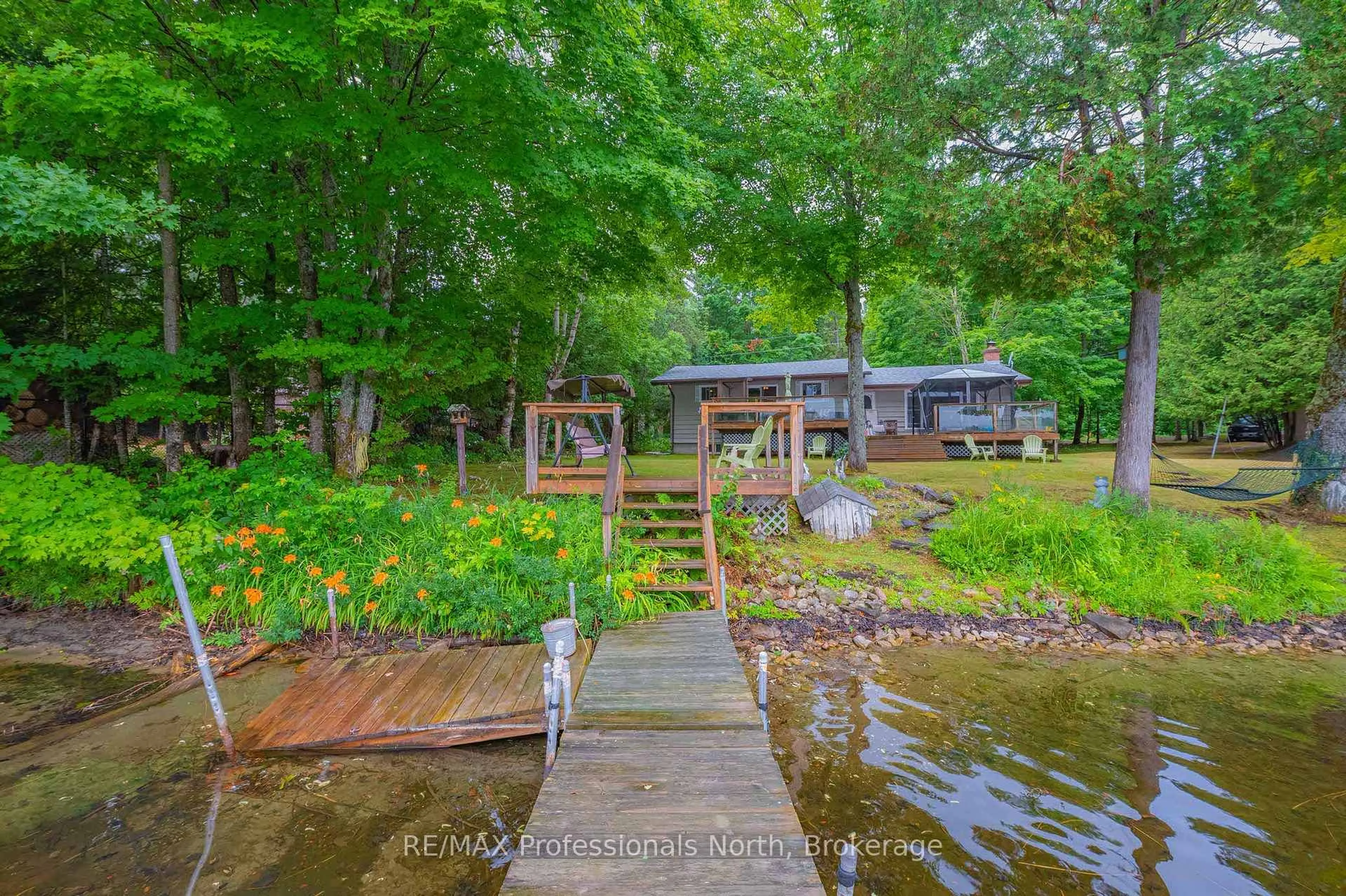 A pic from outside/outdoor area/front of a property/back of a property/a pic from drone, water/lake/river/ocean view for 1582 Hospitality Lake Rd, Minden Hills Ontario K0M 2K0