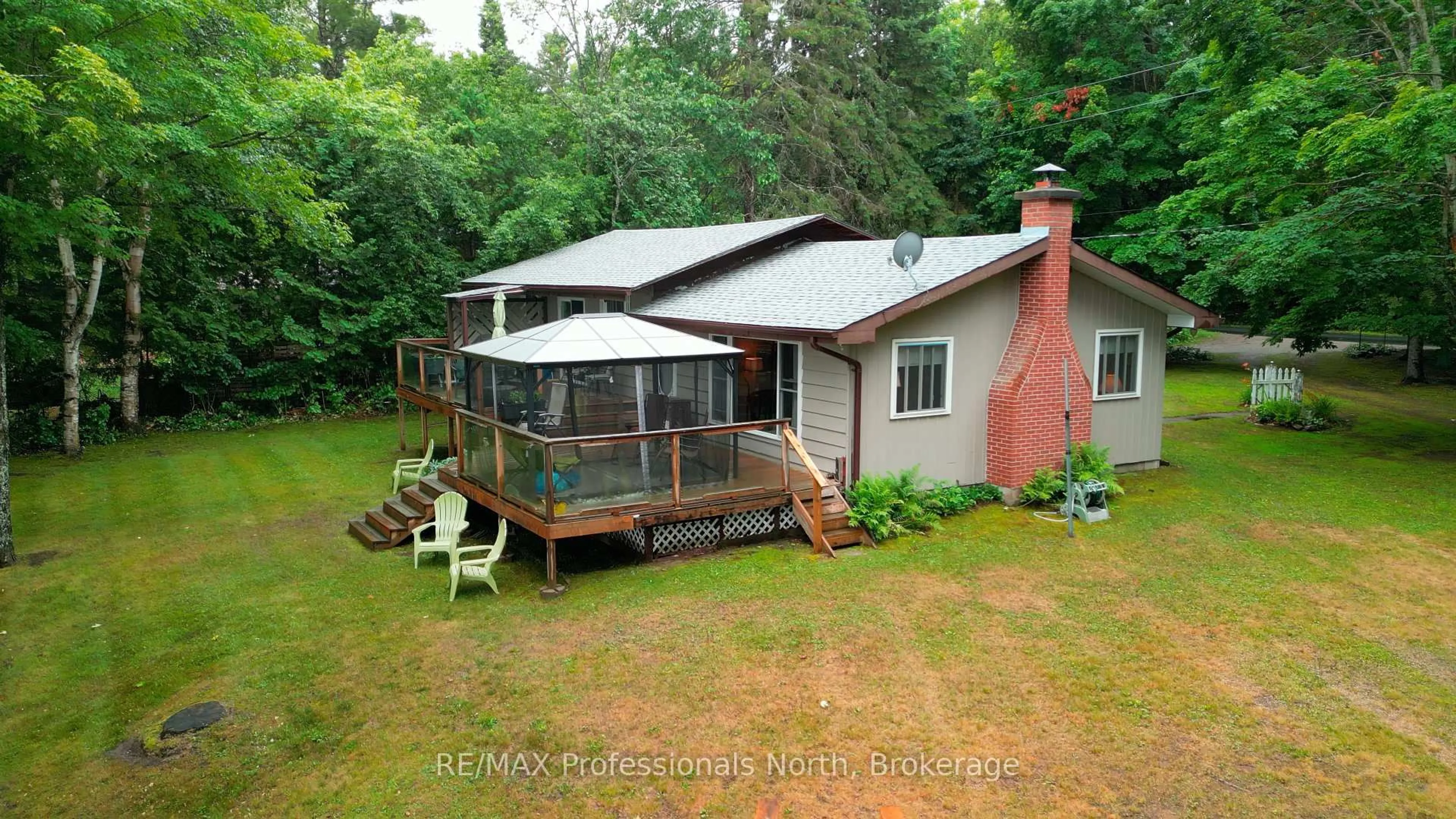 A pic from outside/outdoor area/front of a property/back of a property/a pic from drone, water/lake/river/ocean view for 1582 Hospitality Lake Rd, Minden Hills Ontario K0M 2K0