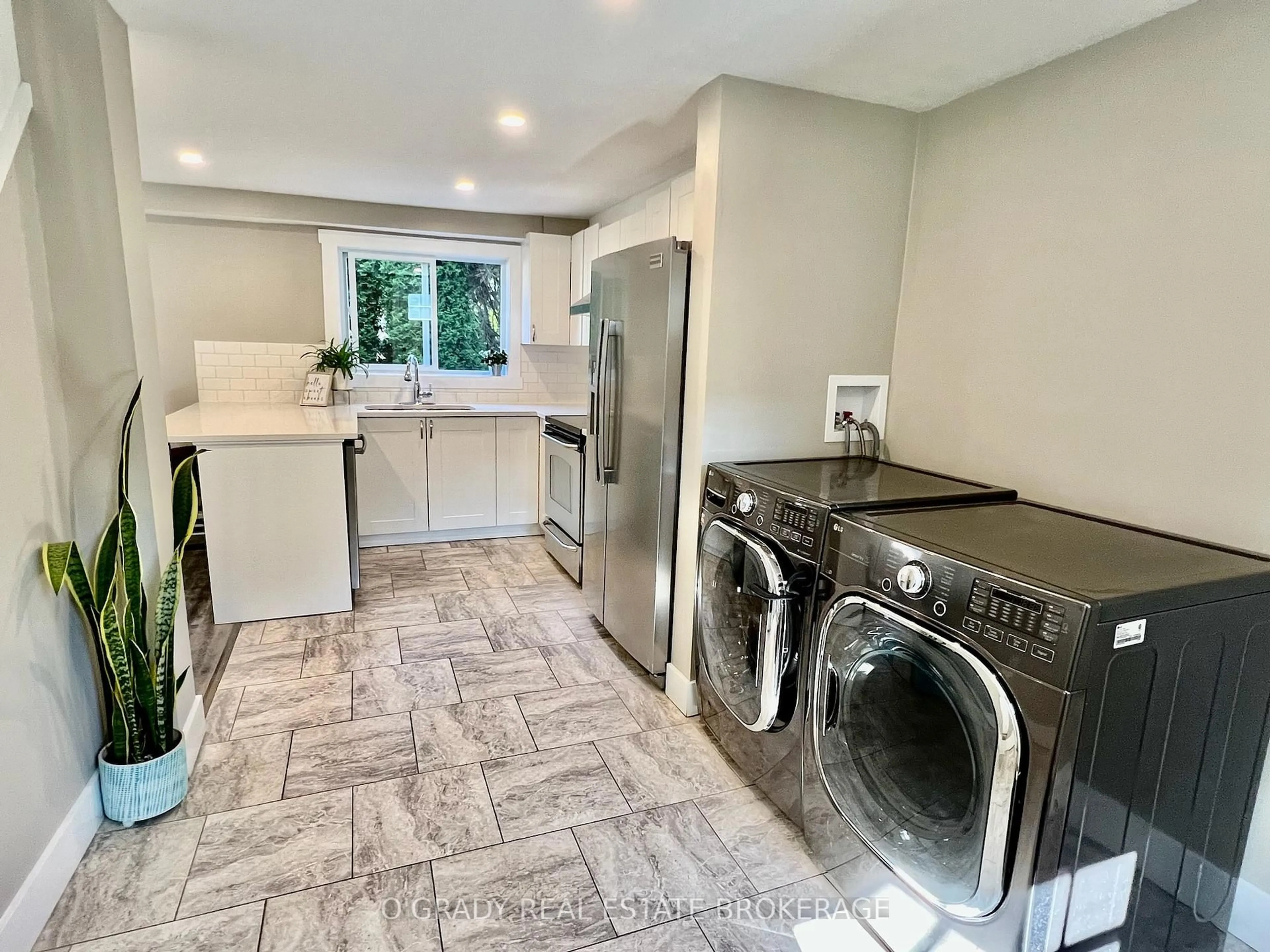 Kitchen with laundary machines, ceramic/tile floor for 8 Edward Lane, Brockville Ontario K6V 5K5