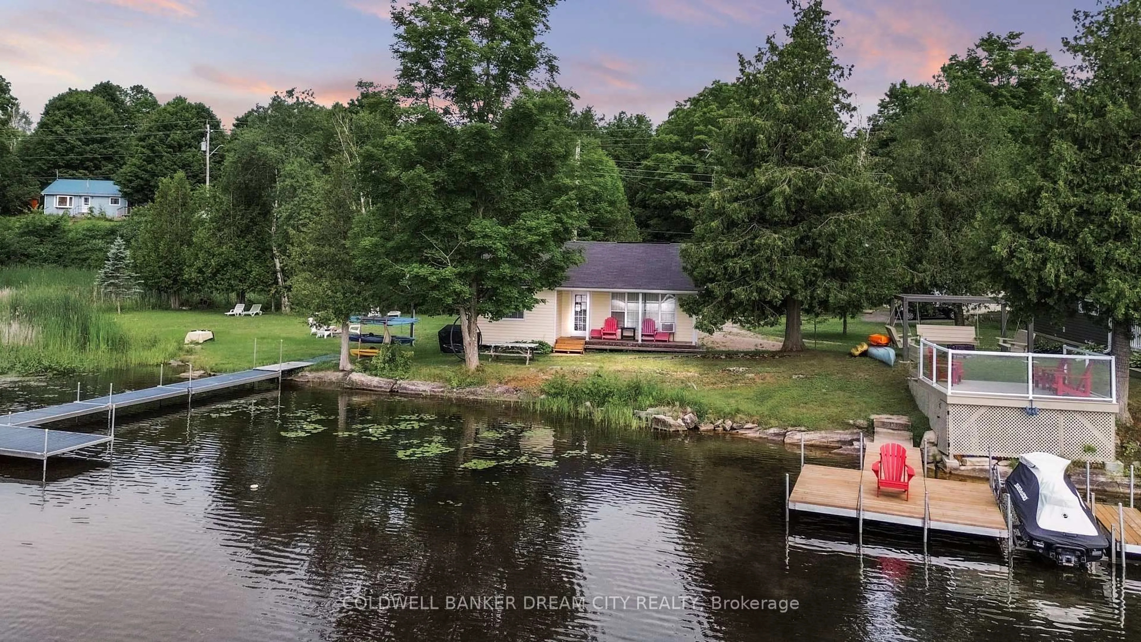 A pic from outside/outdoor area/front of a property/back of a property/a pic from drone, water/lake/river/ocean view for 1004A ALMOND Lane, Arden Ontario K0H 1B0