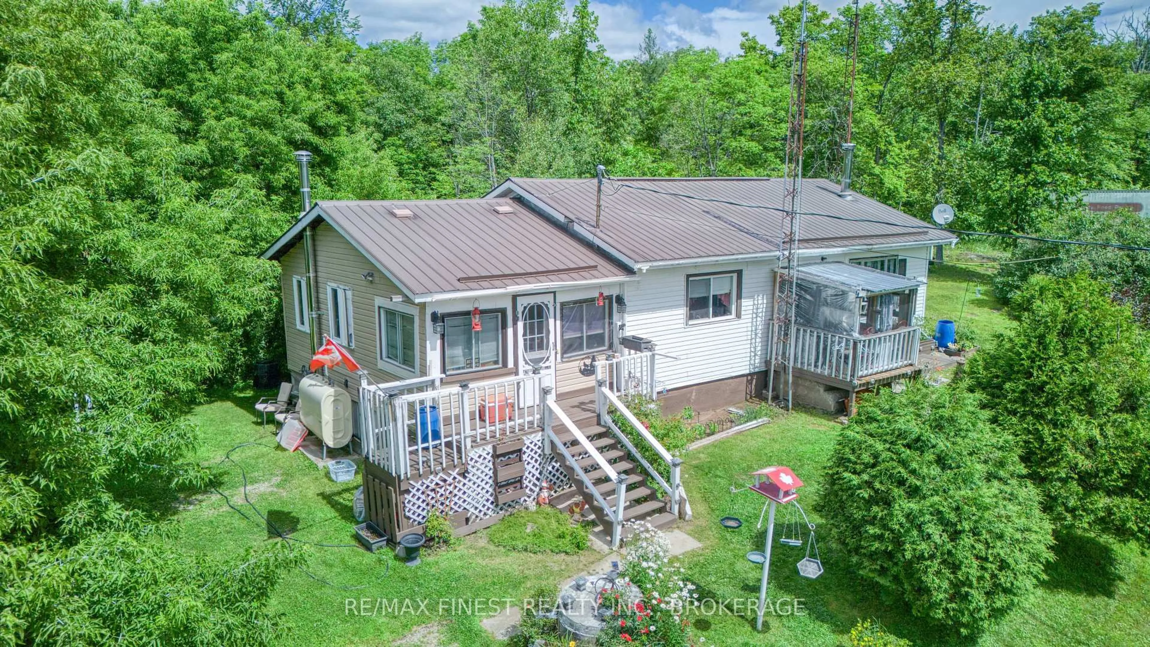 A pic from outside/outdoor area/front of a property/back of a property/a pic from drone, unknown for 30530 Highway 7, Arden Ontario K0H 1B0