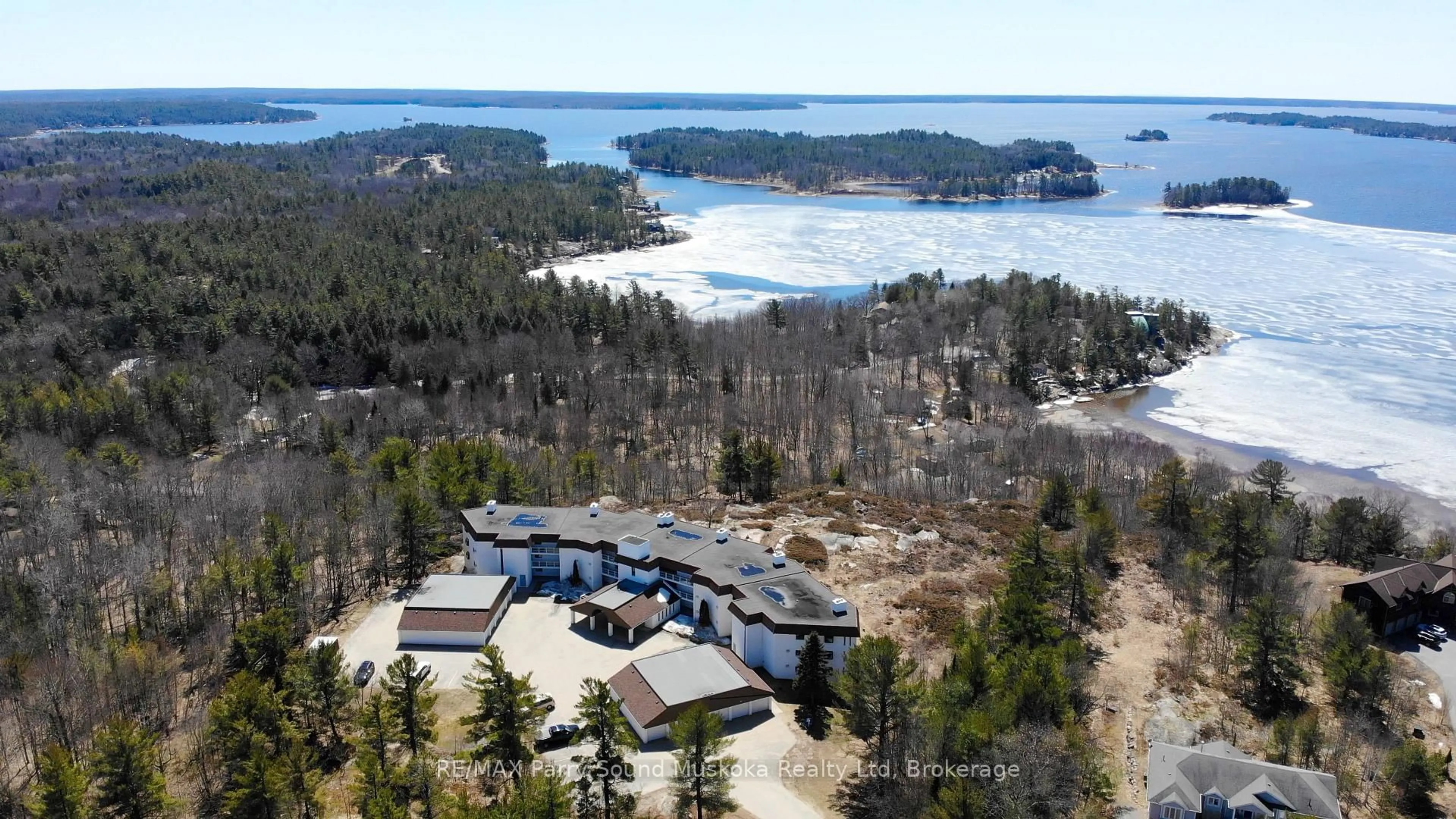 A pic from outside/outdoor area/front of a property/back of a property/a pic from drone, water/lake/river/ocean view for 20 RYDER Dr #2C, McDougall Ontario P2A 2W9