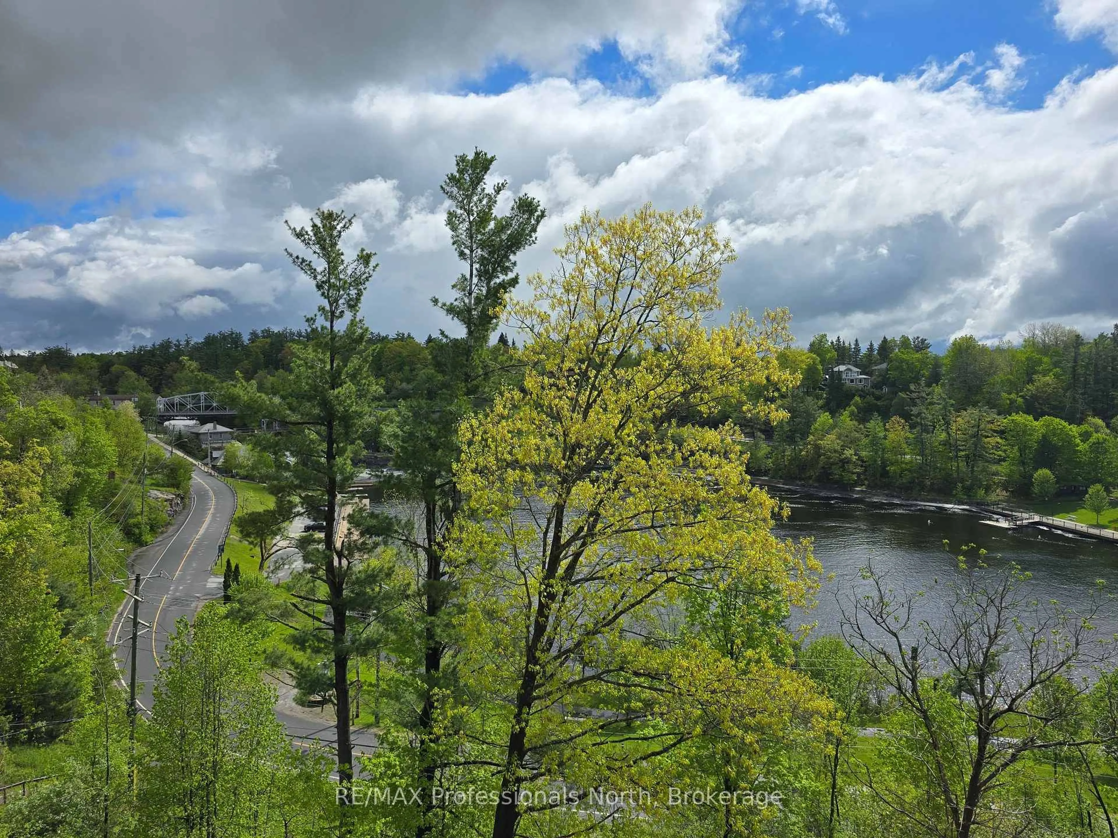 A pic from outside/outdoor area/front of a property/back of a property/a pic from drone, water/lake/river/ocean view for 10A Kimberley Ave #304, Bracebridge Ontario P1L 0A4