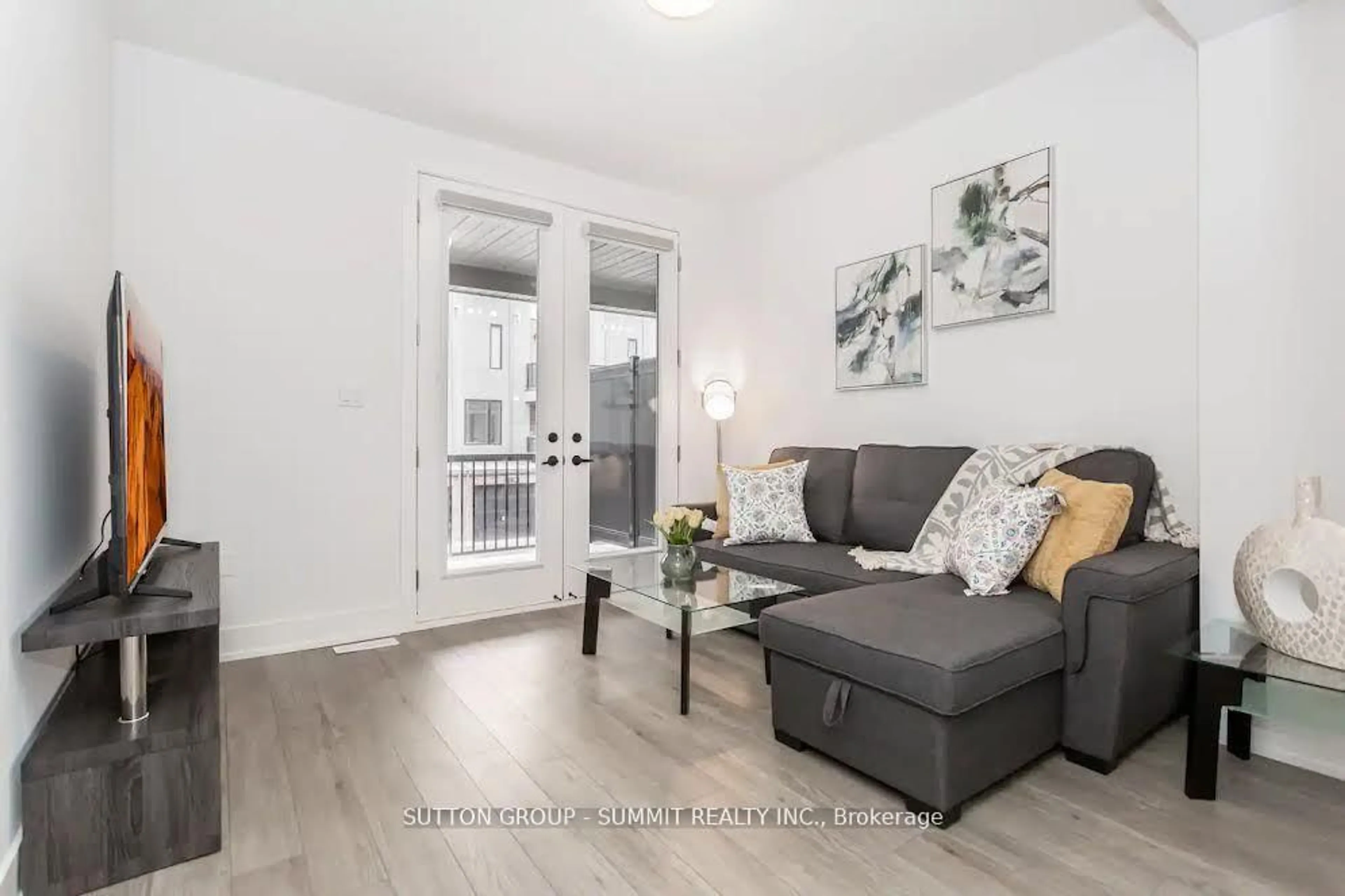 Living room with furniture, wood/laminate floor for 99 Roger St #43, Waterloo Ontario N2J 1A4