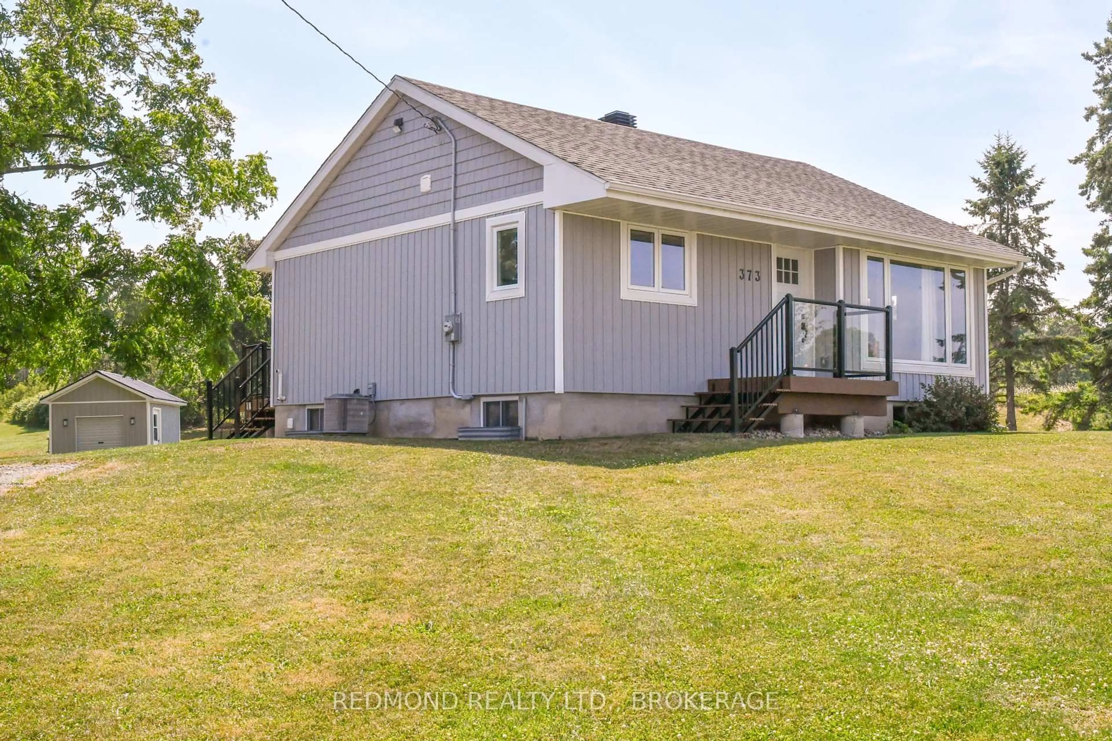 A pic from outside/outdoor area/front of a property/back of a property/a pic from drone, street for 373 Highway 2 Rd, Front of Leeds & Seeleys Bay Ontario K7R 3K6
