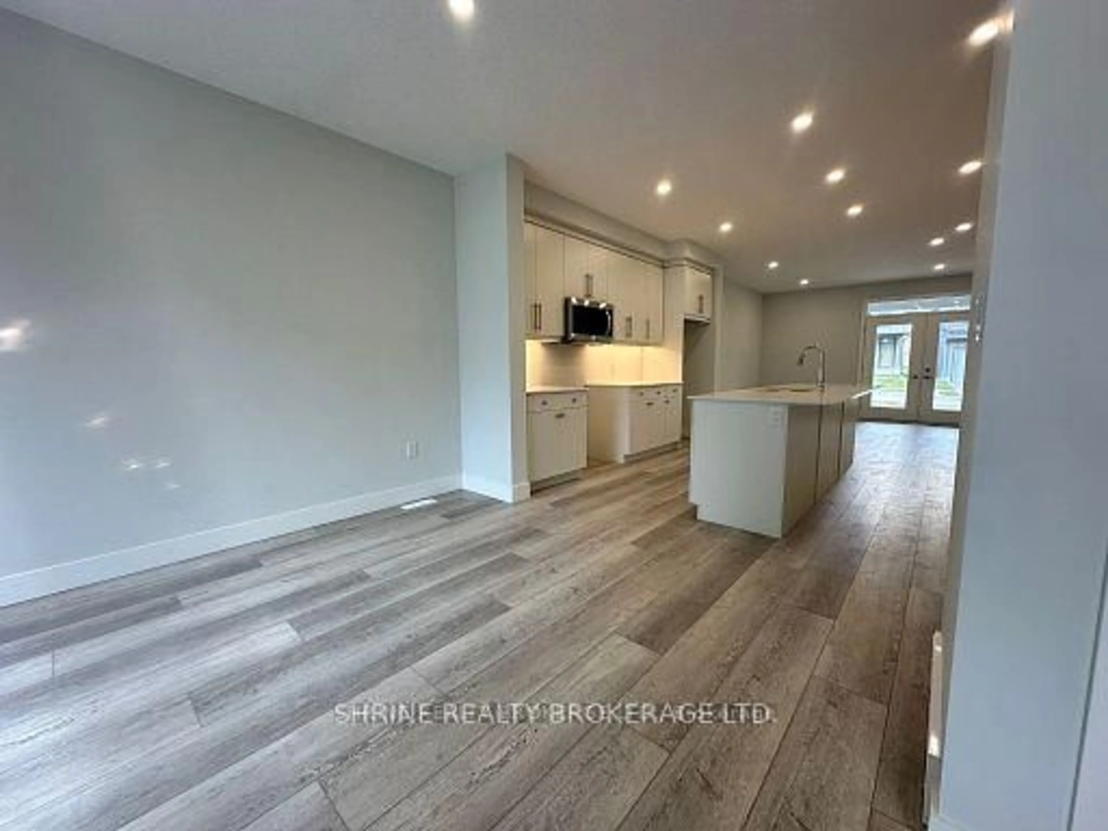 Open concept kitchen, wood/laminate floor for 990 Deveron Cres #1, London South Ontario N5Z 5A4