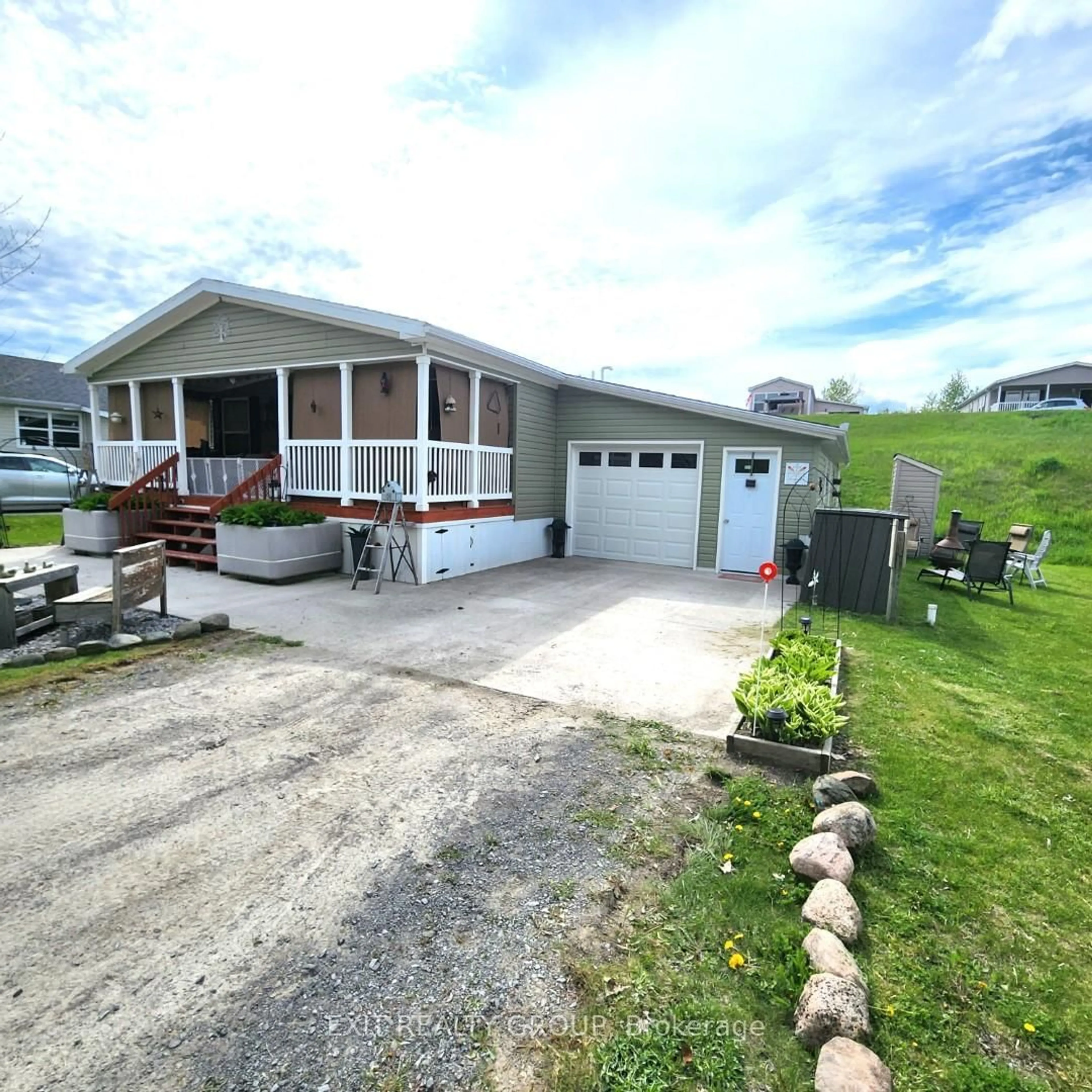 A pic from outside/outdoor area/front of a property/back of a property/a pic from drone, street for 32-152 Concession Rd 11 W, Trent Hills Ontario K0K 1Y0