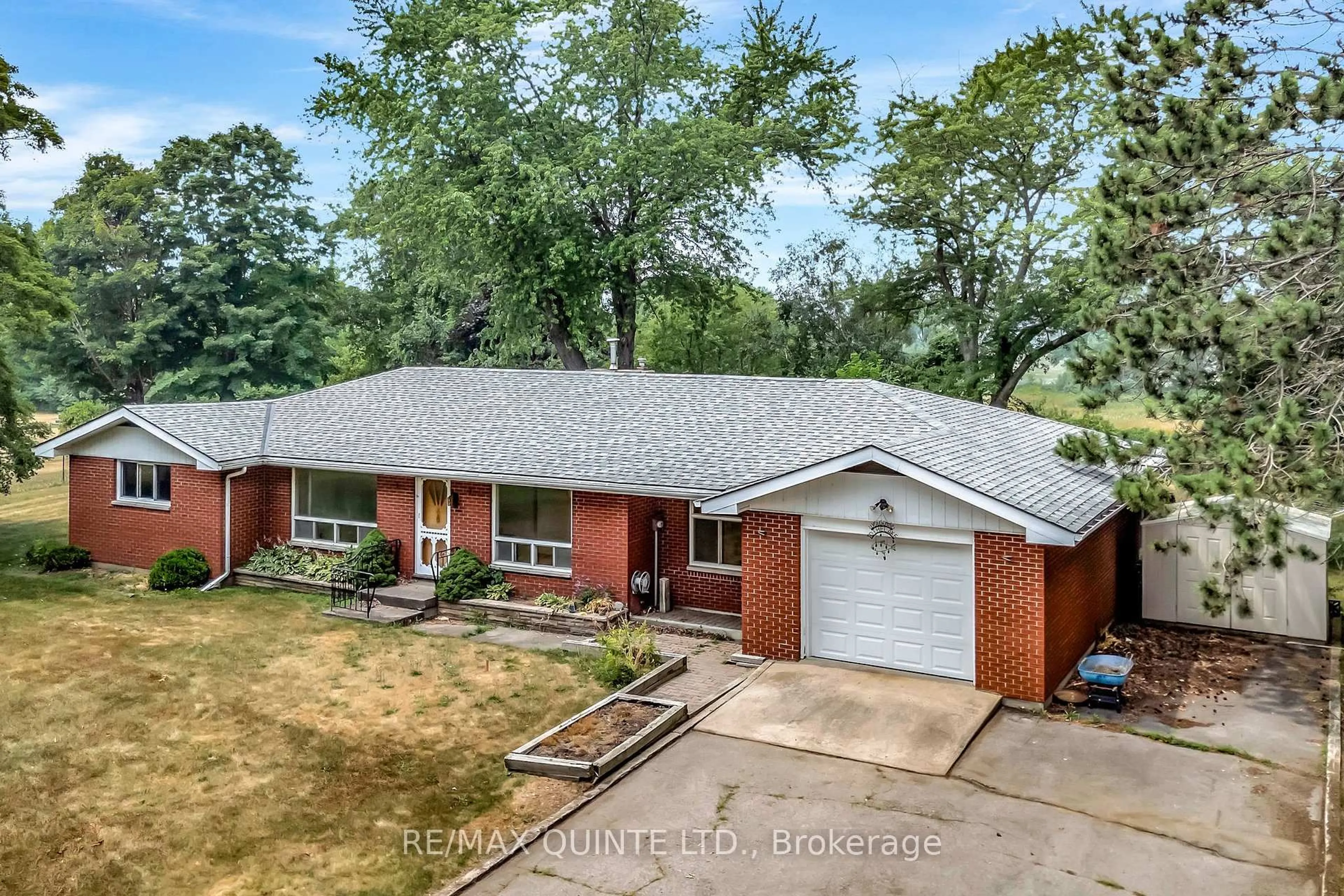 A pic from outside/outdoor area/front of a property/back of a property/a pic from drone, street for 1462 County Road 12, Prince Edward County Ontario K0K 2T0
