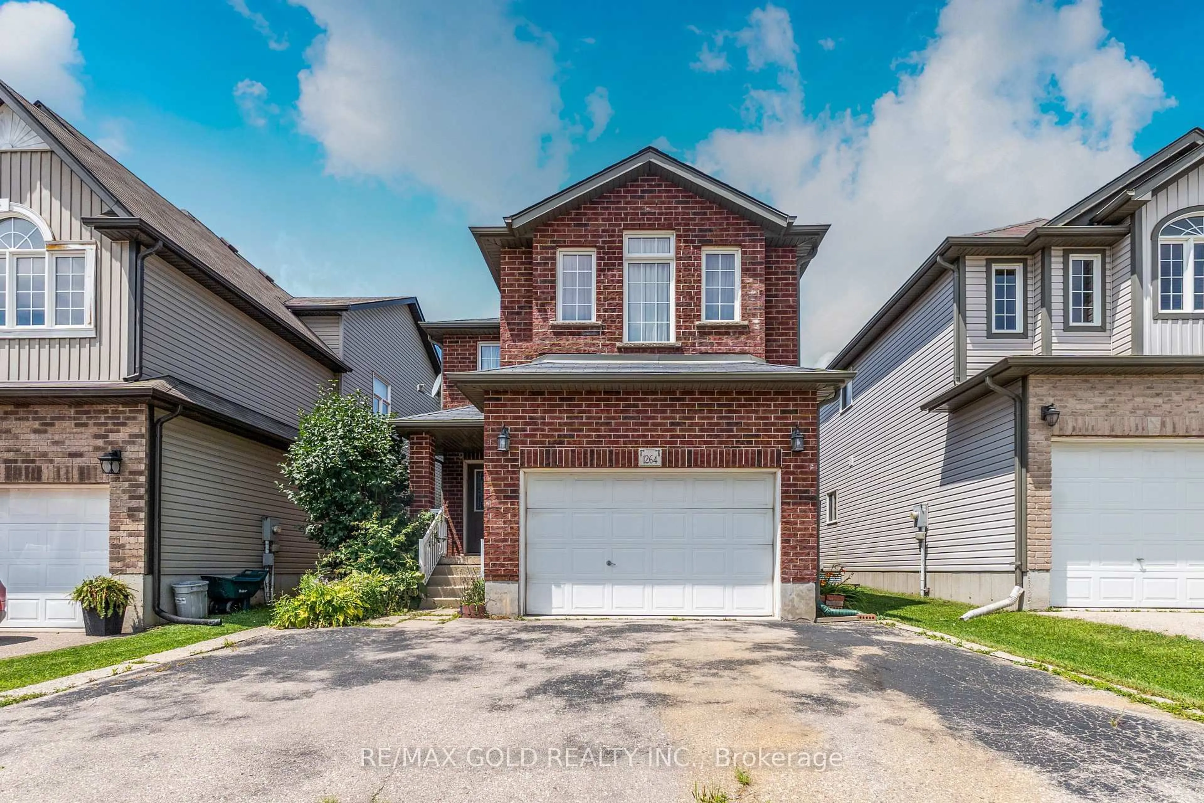 Home with brick exterior material, street for 1264 Countrystone Dr, Kitchener Ontario N2N 3S4