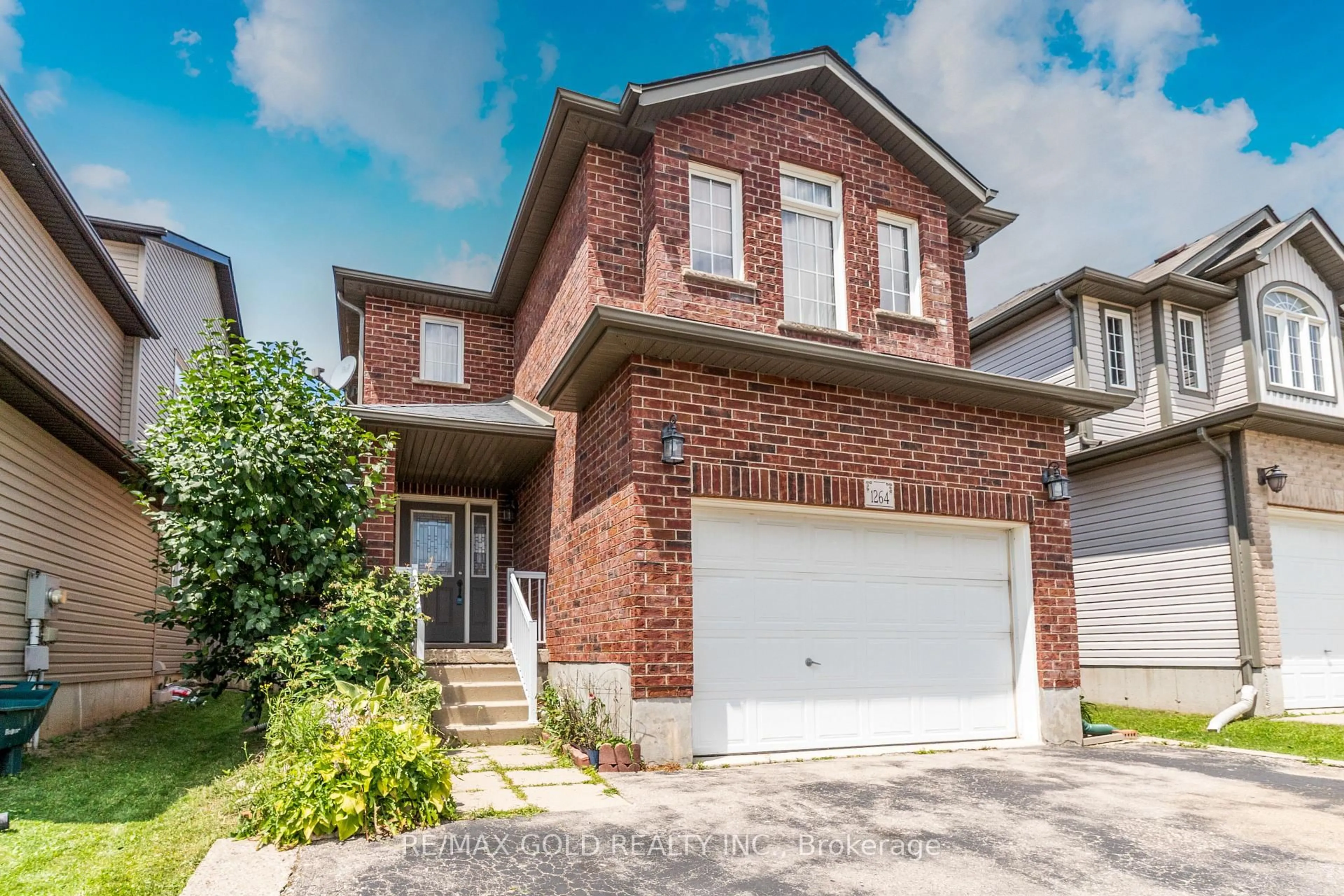 Home with brick exterior material, street for 1264 Countrystone Dr, Kitchener Ontario N2N 3S4